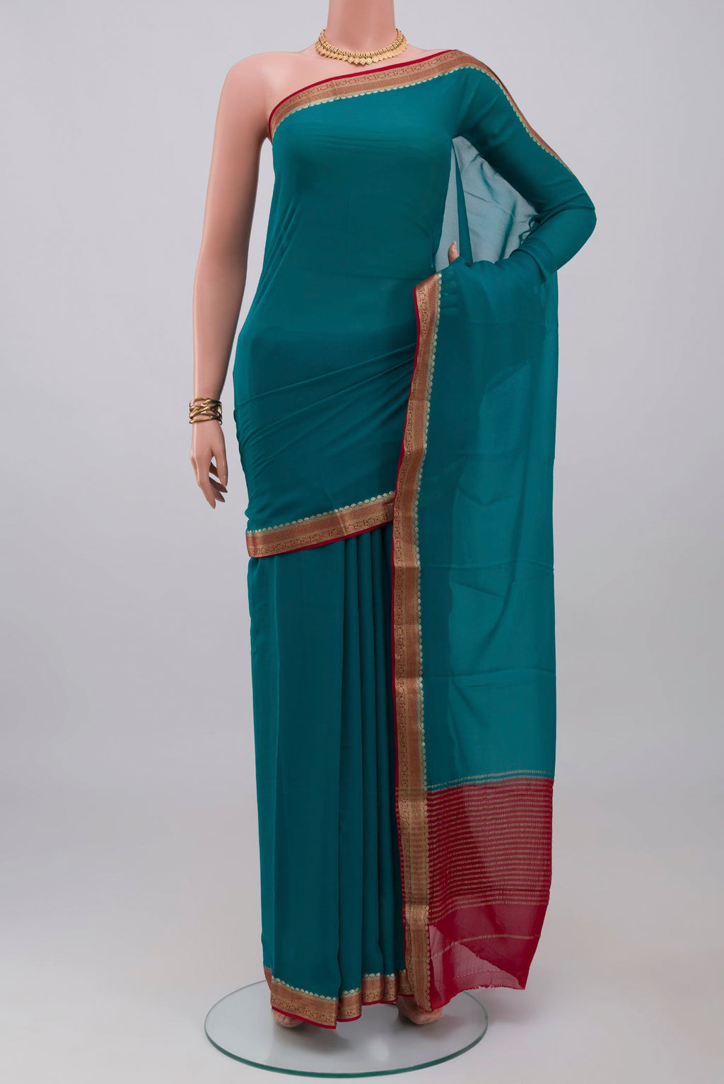Blue Mysore Georgette Saree with Plain Body and Zari Border.  displayed on a mannequin