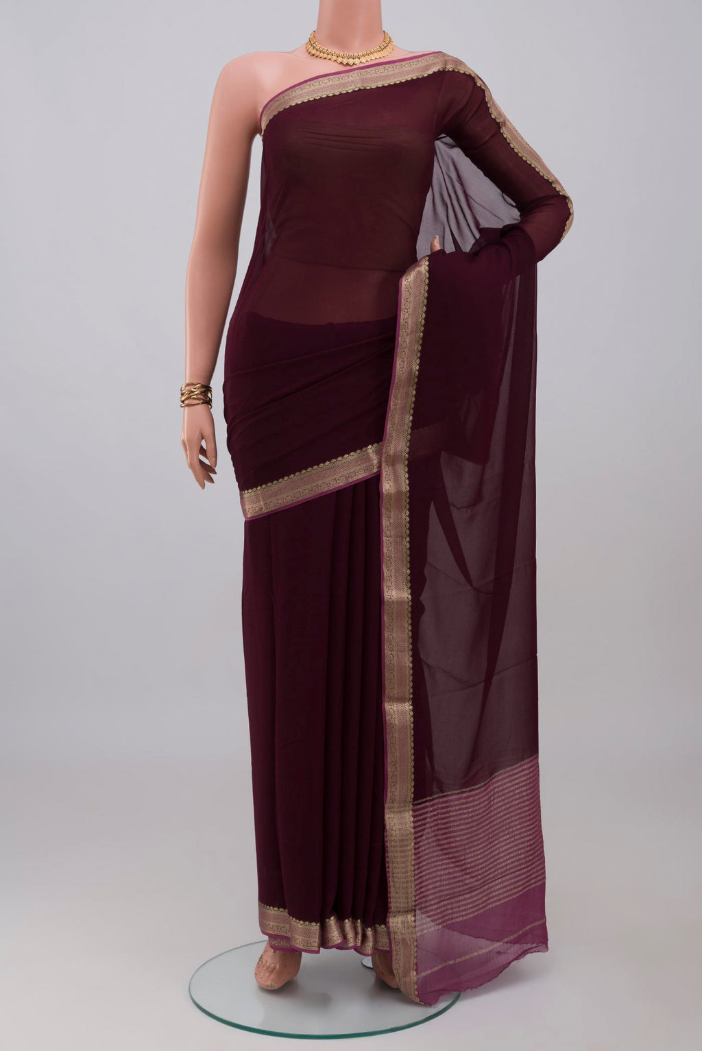 Coffee Brown Mysore Georgette Saree with Plain Body and Zari Border.  displayed on a mannequin