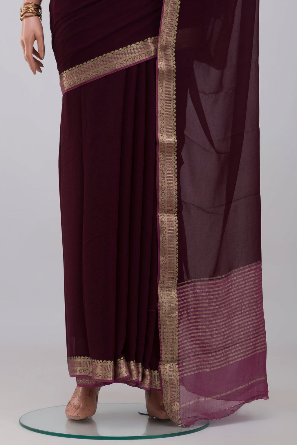 Pleats and pallu of Coffee Brown Mysore Georgette Saree with Plain Body and Zari Border. 