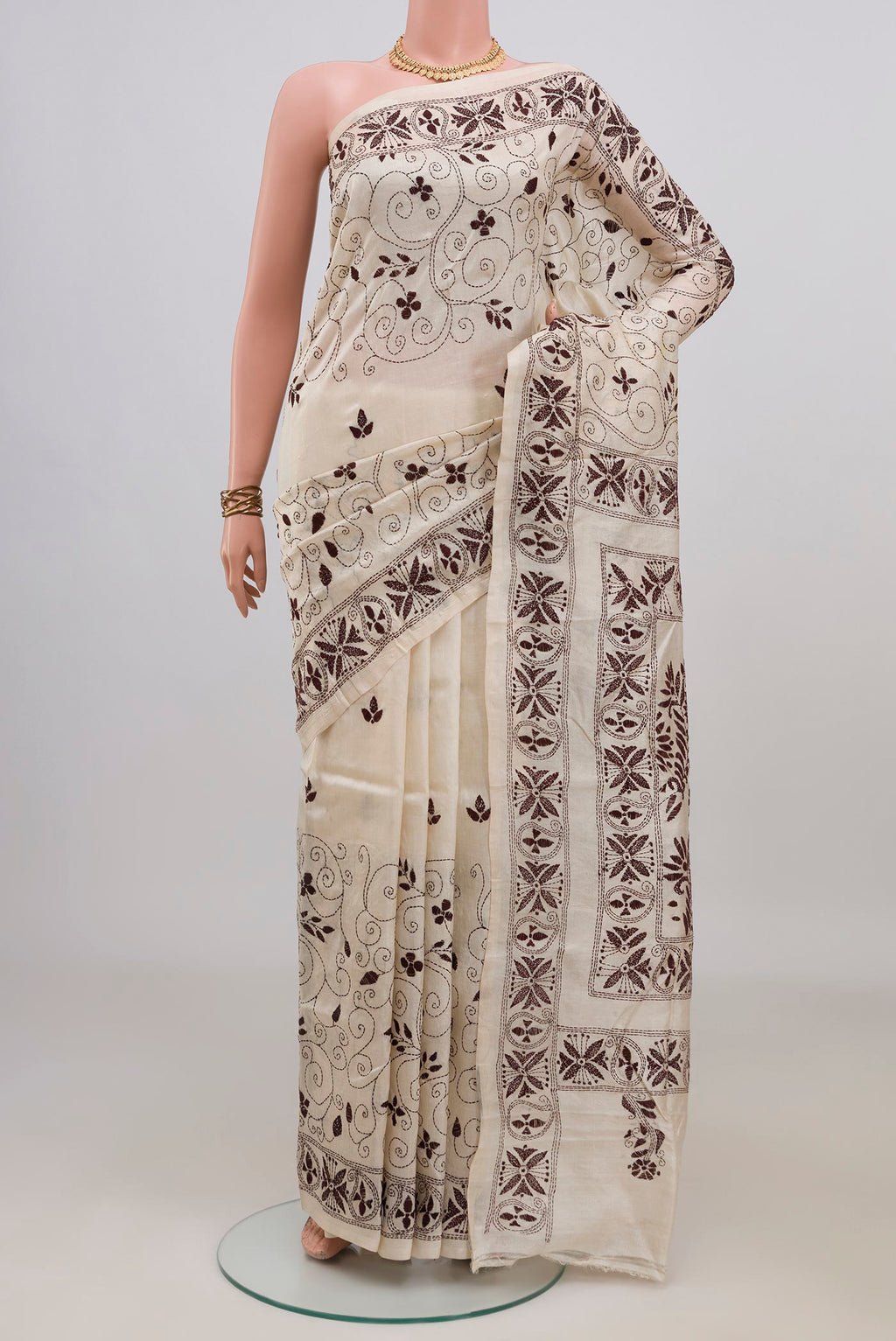 Cream Tussar Saree with Kantha Work on the body and Thread Border.  displayed on a mannequin