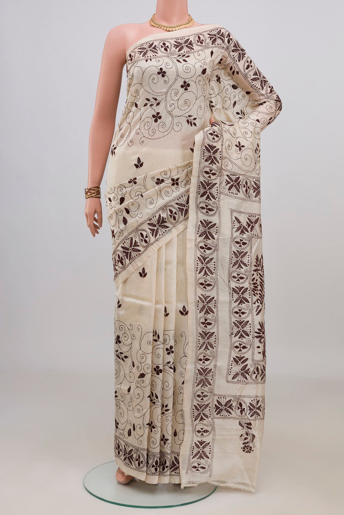 Cream Tussar Saree with Kantha Work on the body and Thread Border.  displayed on a mannequin