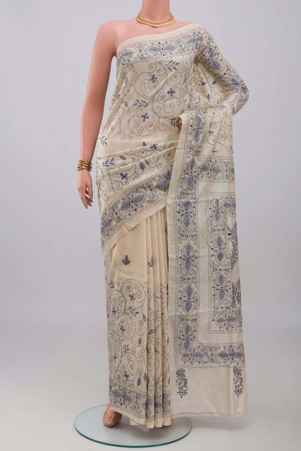 Cream Tussar Silk Saree with Kantha Work on the body and Thread Border.  displayed on a mannequin