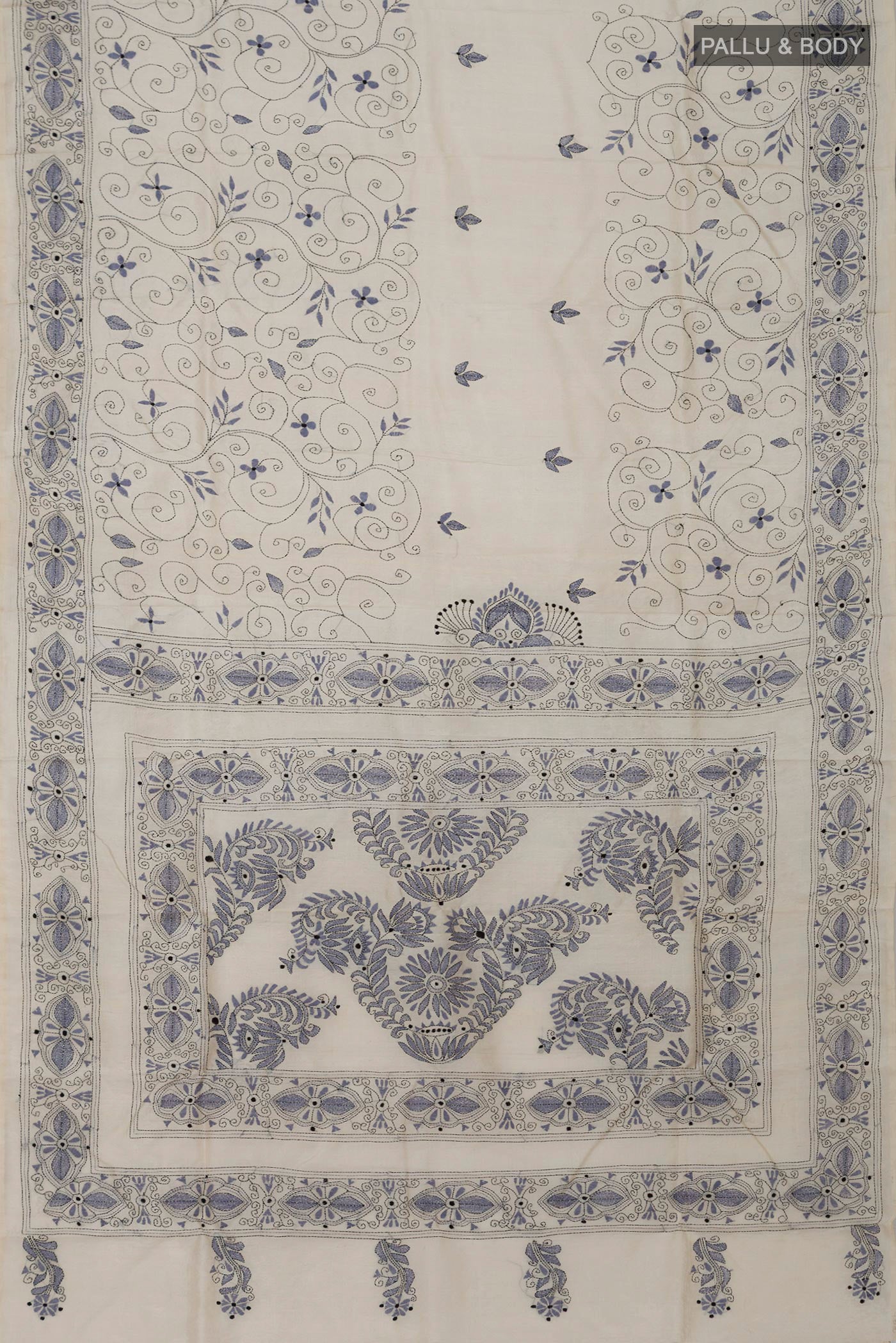 Flat view of Cream Tussar Silk Saree with Kantha Work on the body and Thread Border. 