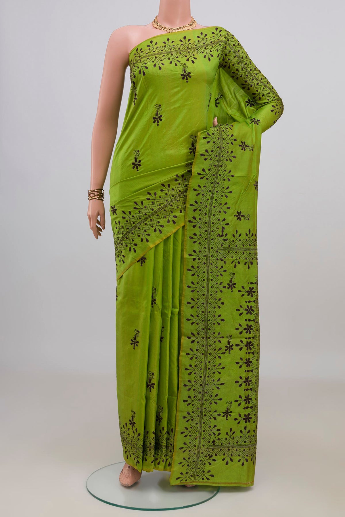 Green Tussar Saree with Kantha Work on the body and Thread Border.  displayed on a mannequin