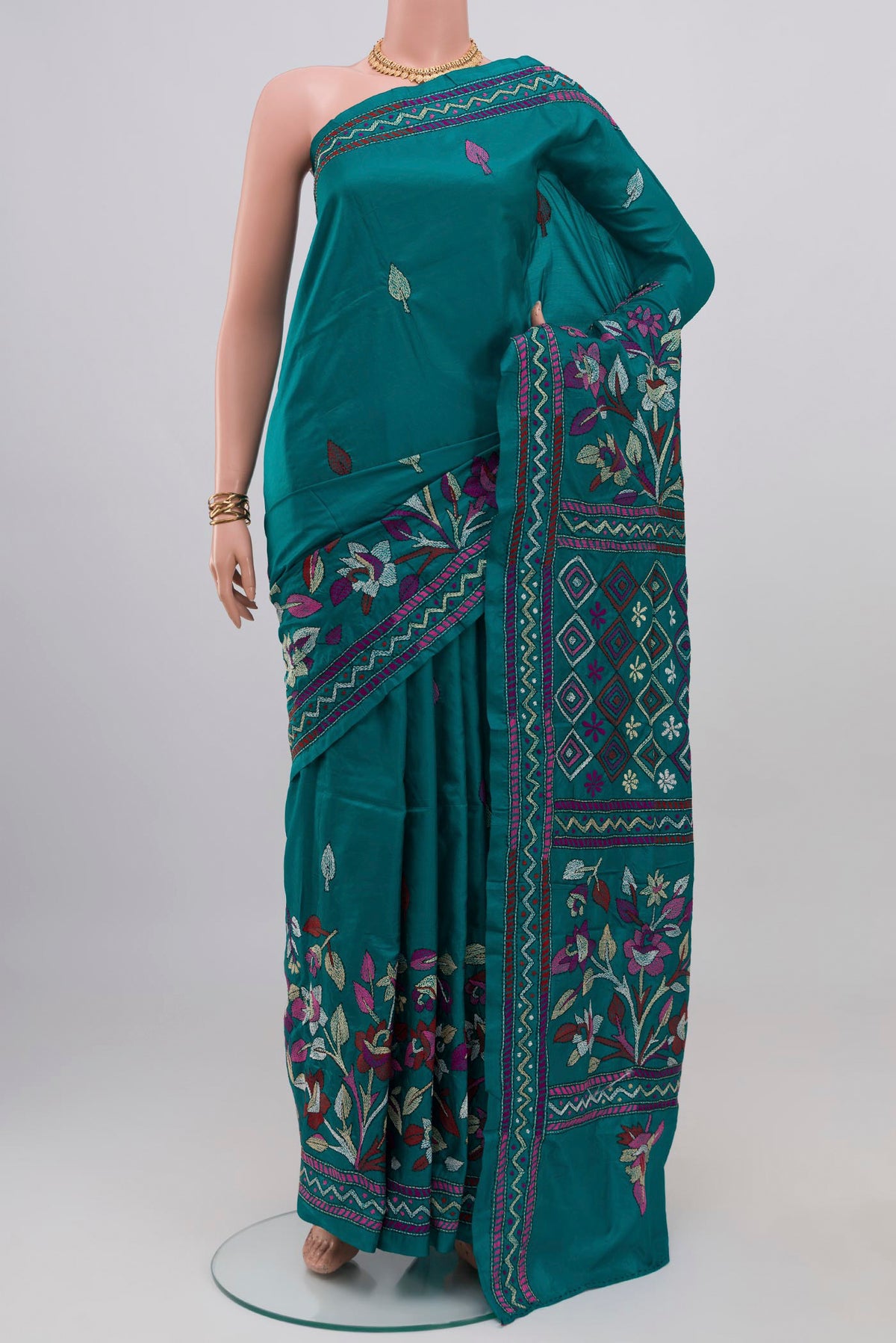 Teal Kantha Silk Saree with Kantha Work on the body and Thread Border.  displayed on a mannequin