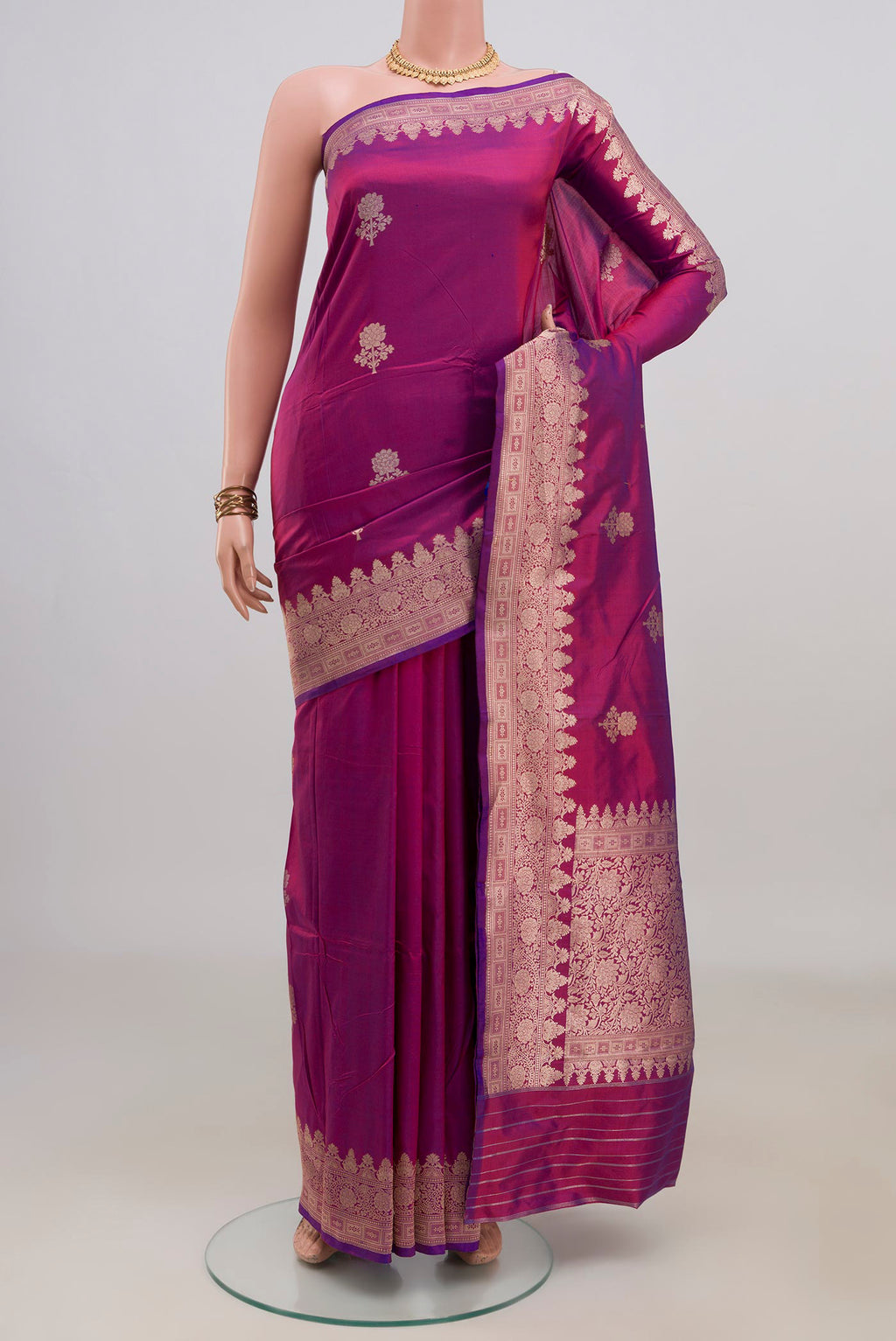 Pure Silk Magenta Banarasi Katan Saree with Zari Butta on the body and Fancy Border.  displayed on a mannequin