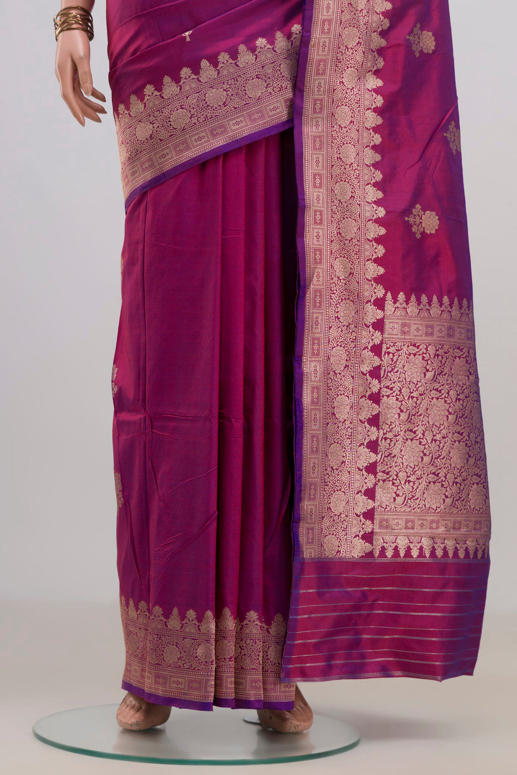 Pleats and pallu of Pure Silk Magenta Banarasi Katan Saree with Zari Butta on the body and Fancy Border. 
