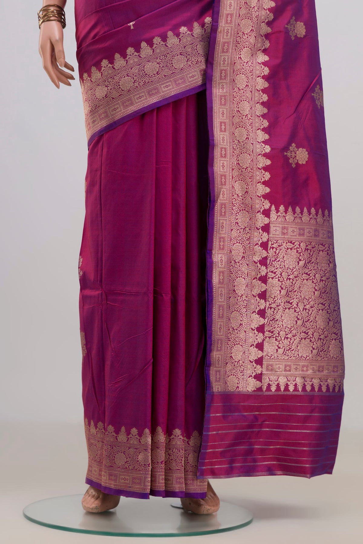 Pleats and pallu of Pure Silk Magenta Banarasi Katan Saree with Zari Butta on the body and Fancy Border. 