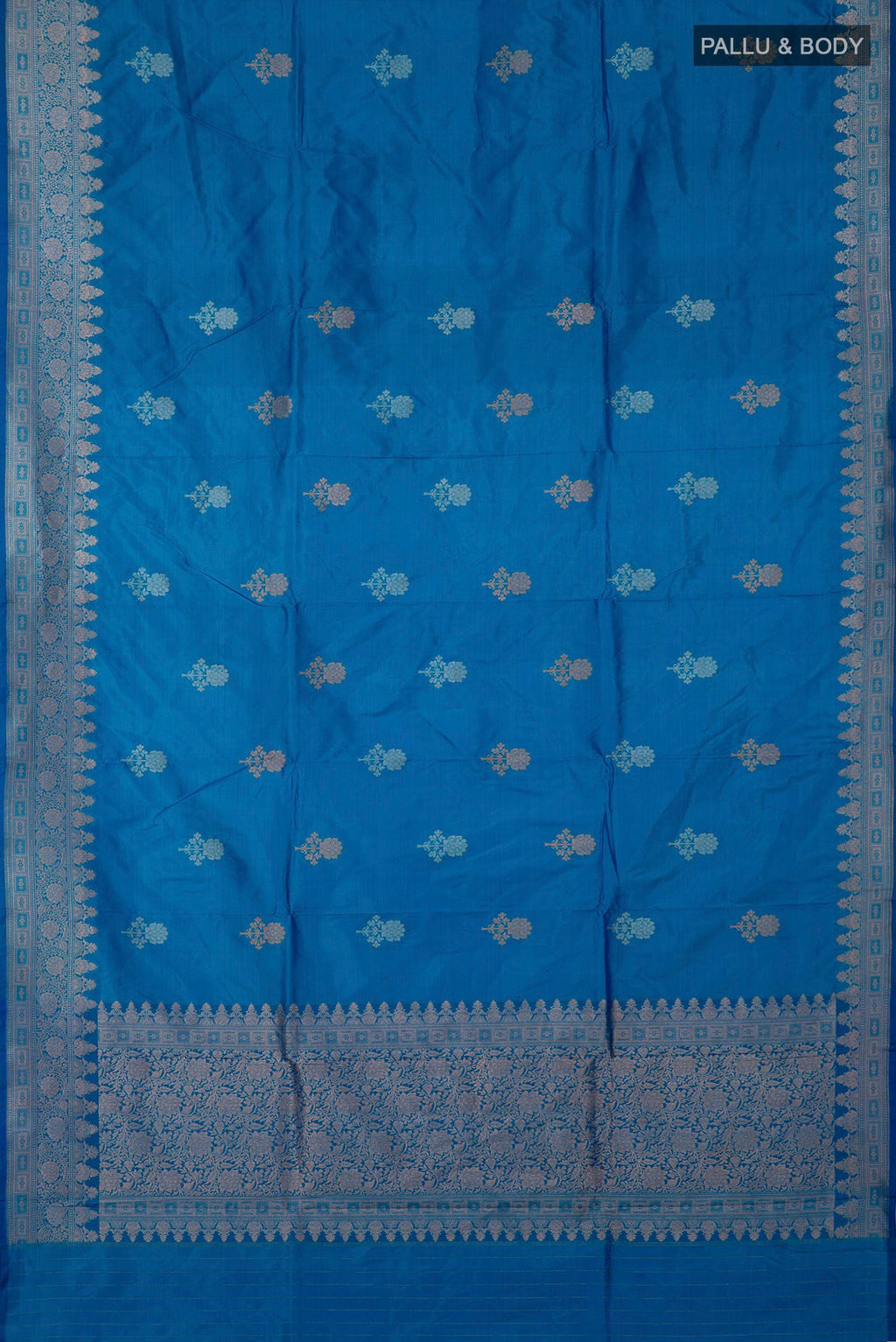 Flat view of Blue Banarasi Katan Silk Saree with Zari Butta on the body and Zari Border. 