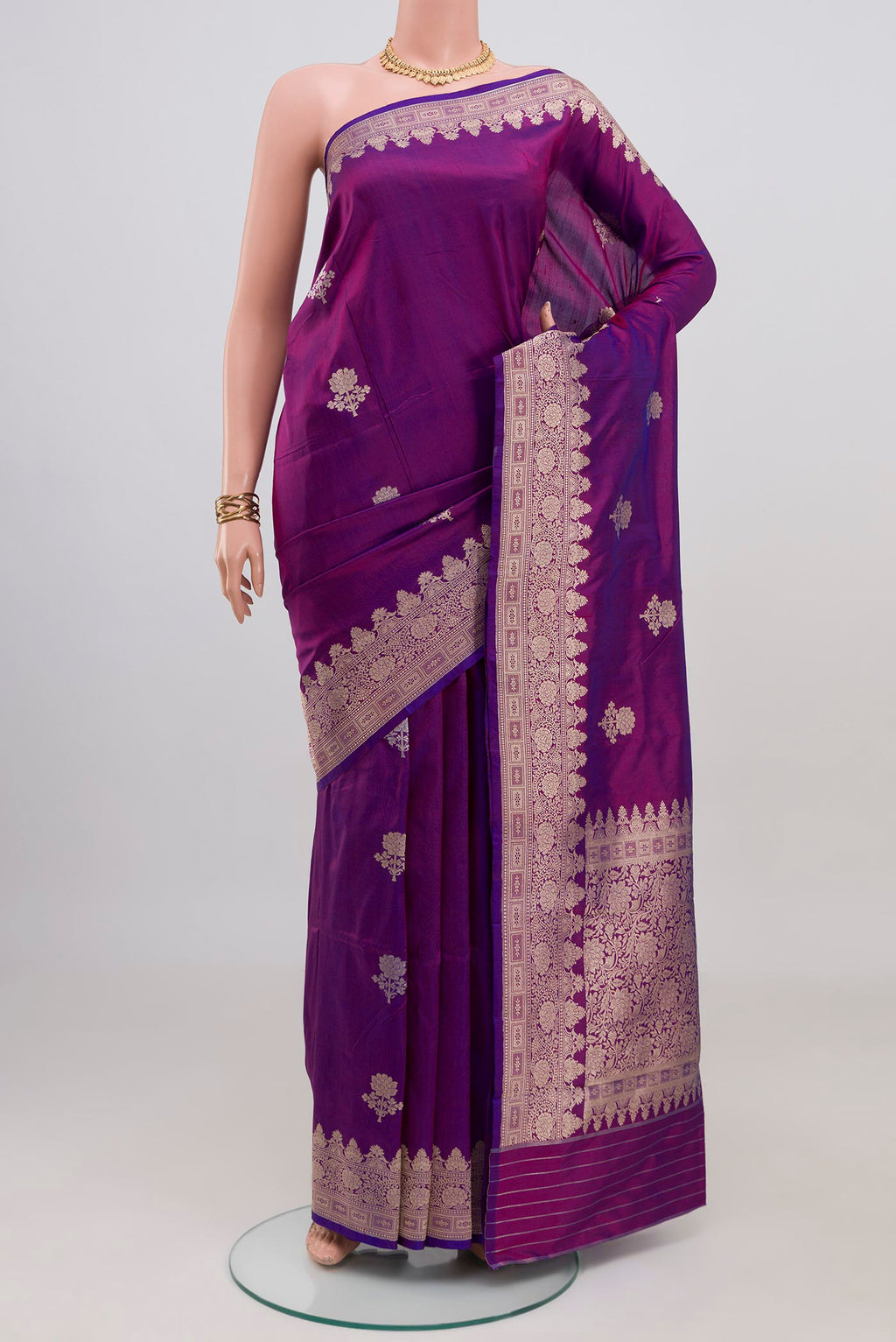 Purple Banarasi Katan Silk Saree with Zari Butta on the body and Zari Border.  displayed on a mannequin