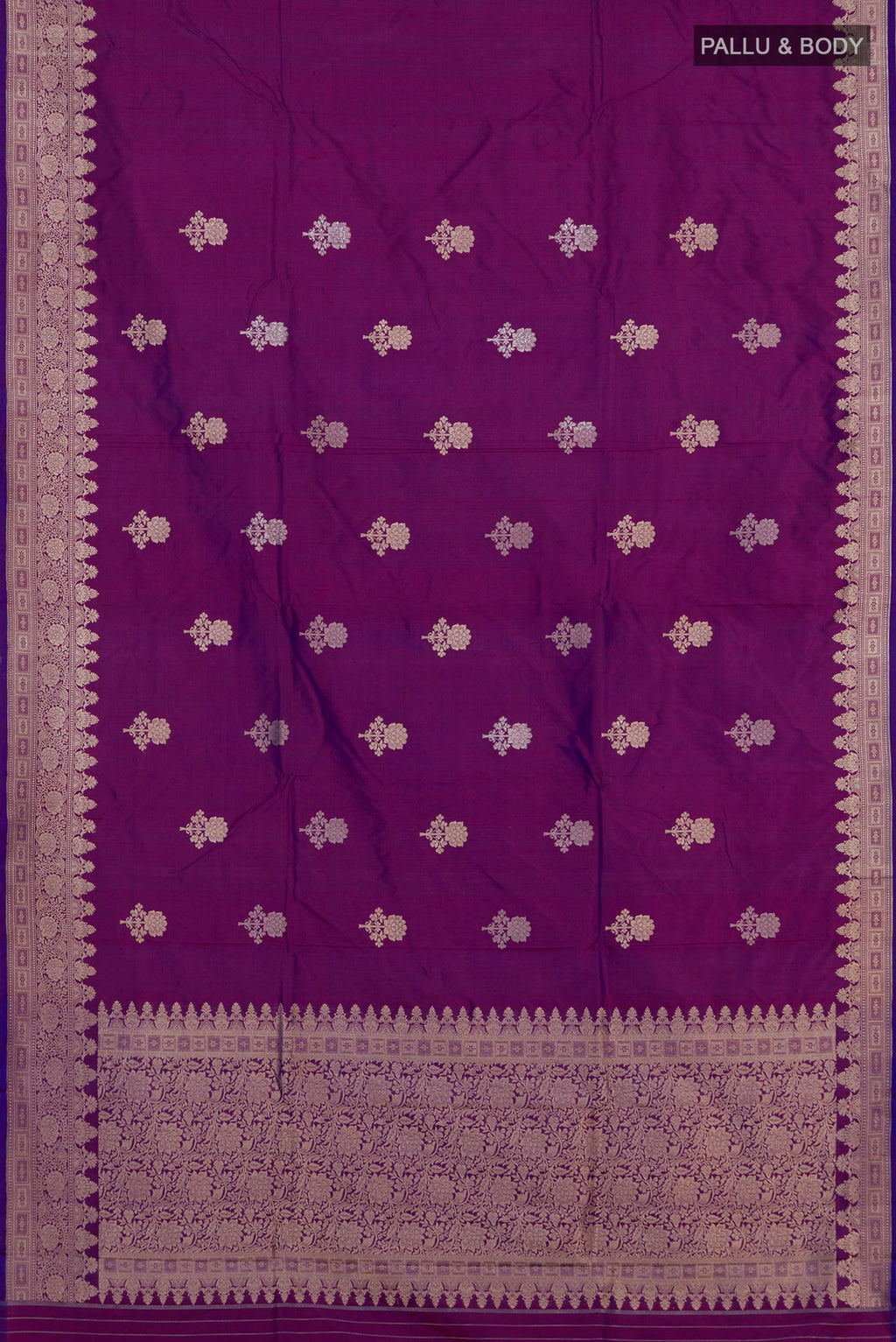 Flat view of Purple Banarasi Katan Silk Saree with Zari Butta on the body and Zari Border. 