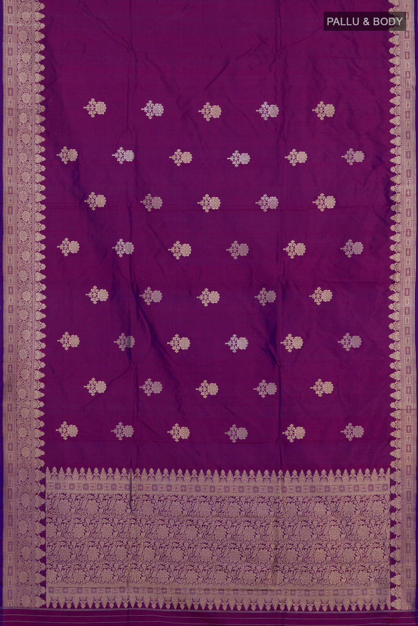 Flat view of Purple Banarasi Katan Silk Saree with Zari Butta on the body and Zari Border. 