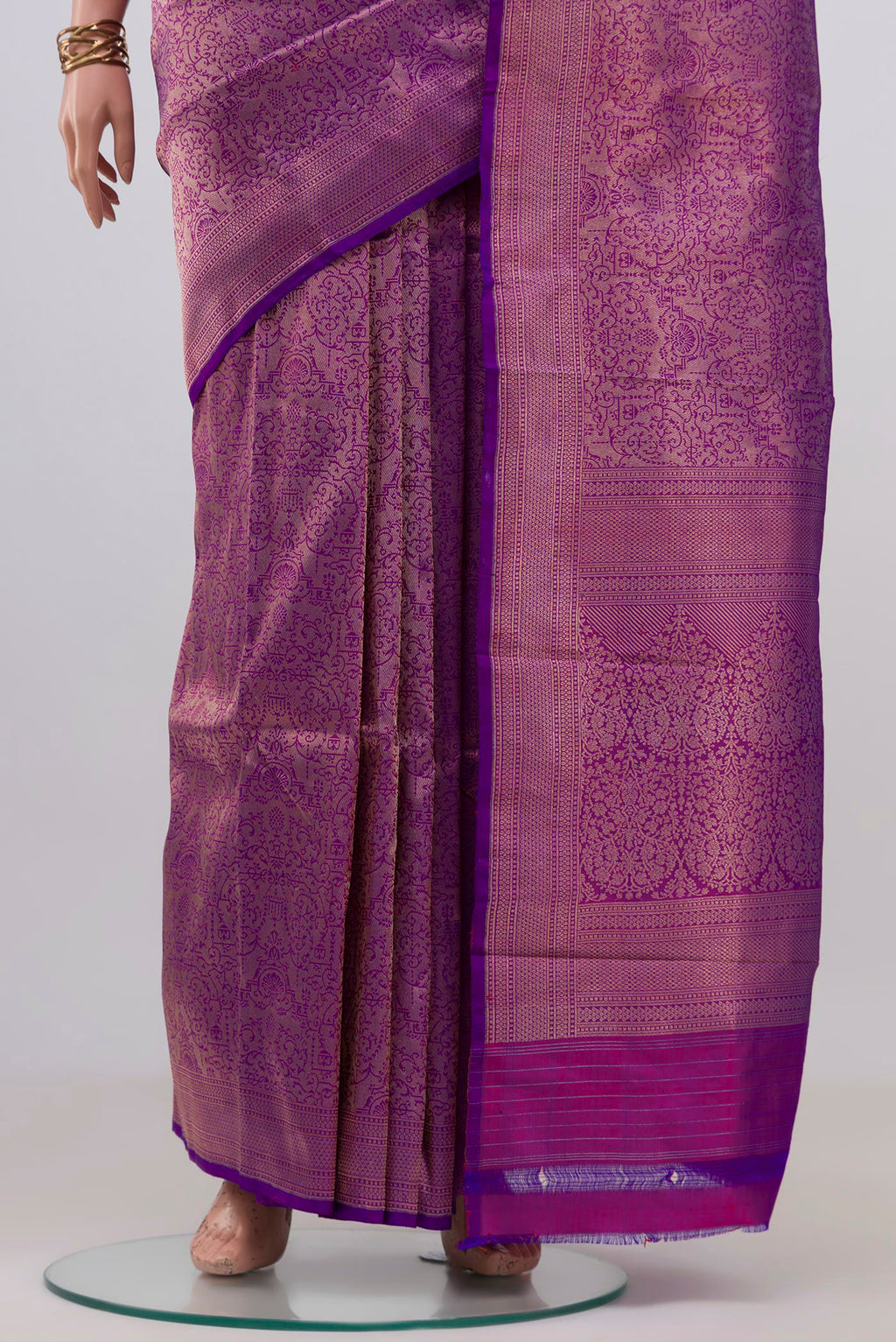 Pleats and pallu of Purple Banarasi Katan Silk Saree with Zari Brocade on the body and Zari Border. 