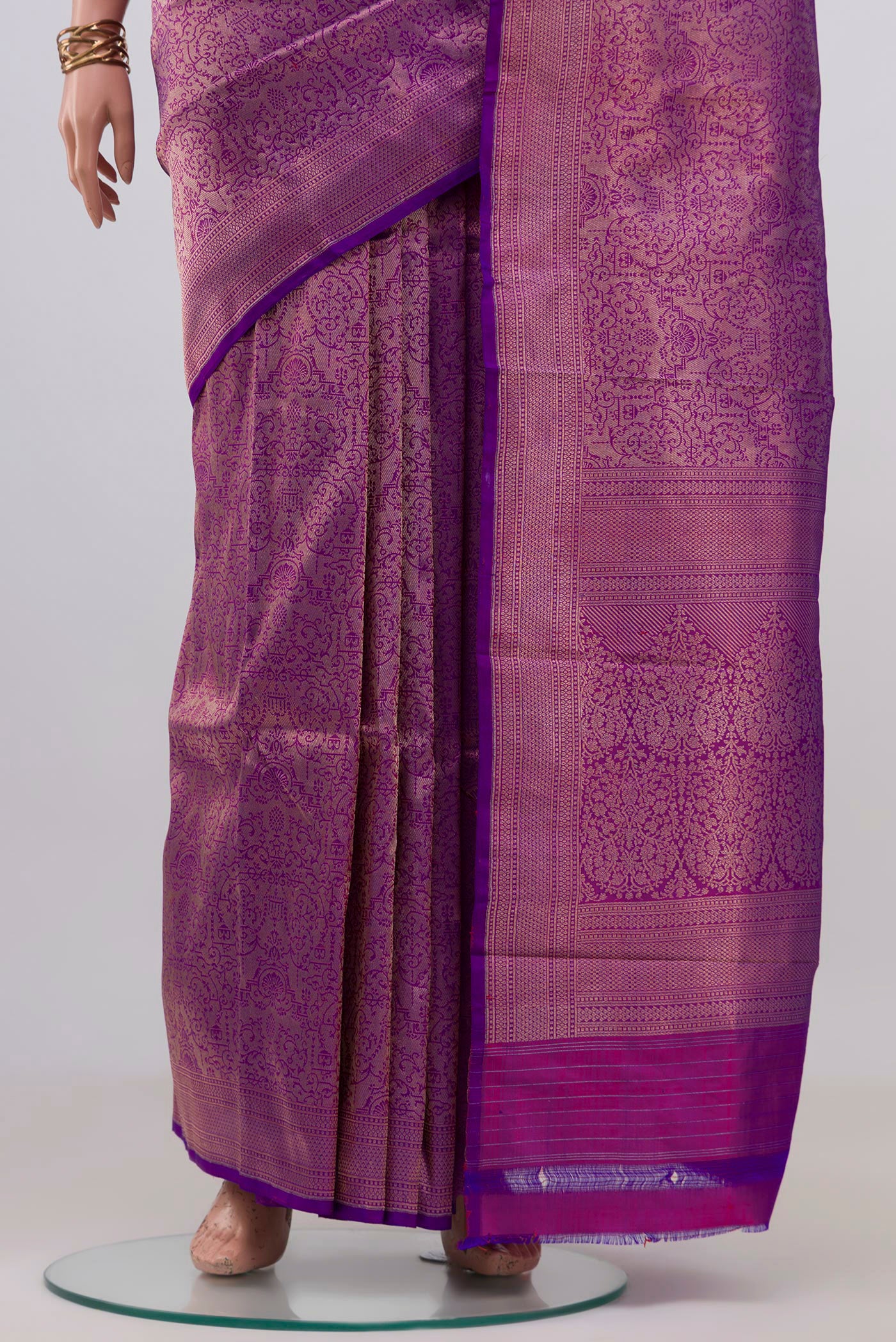 Pleats and pallu of Purple Banarasi Katan Silk Saree with Zari Brocade on the body and Zari Border. 
