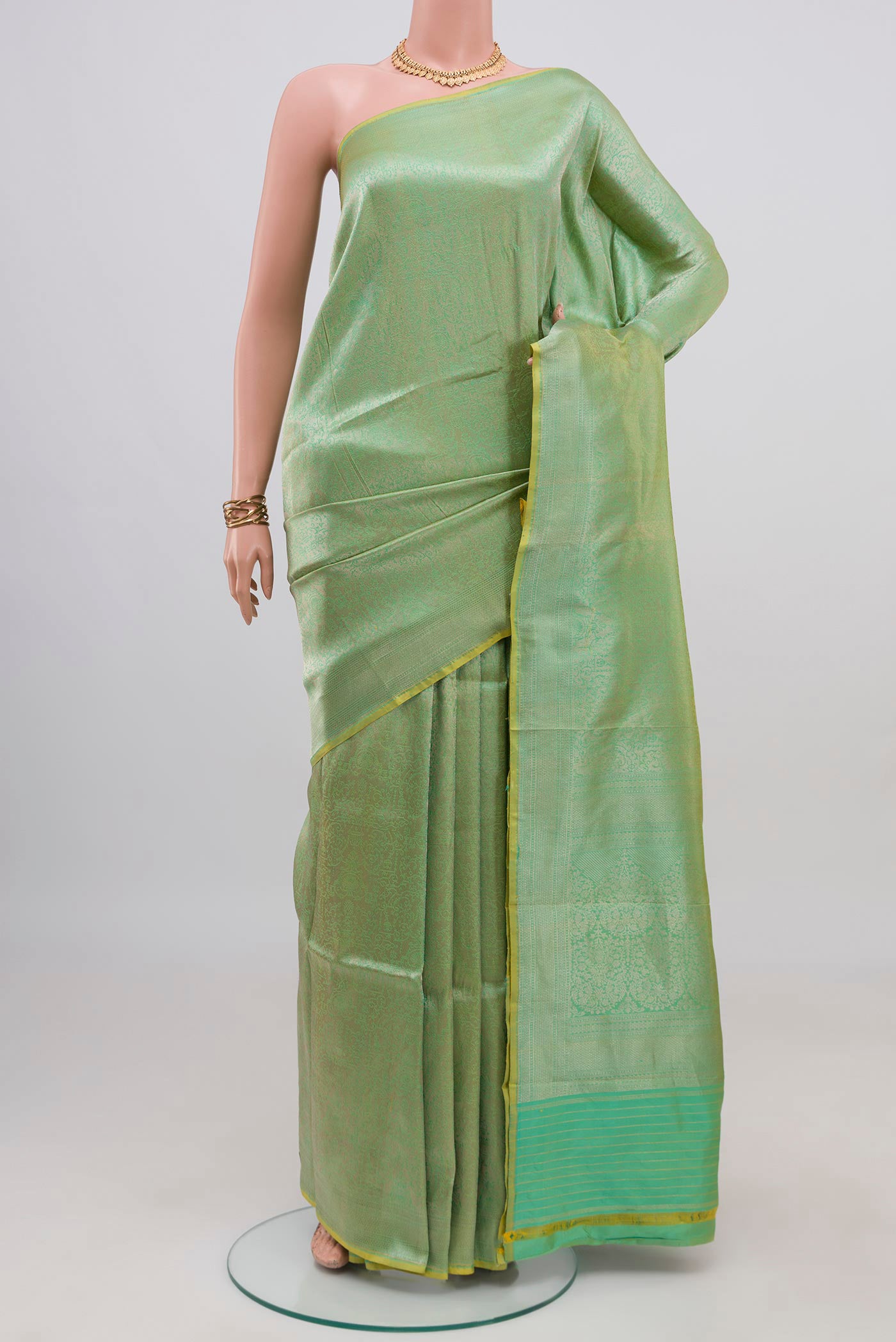 Sea Green Banarasi Katan Silk Saree with Zari Brocade on the body and Zari Border.  displayed on a mannequin