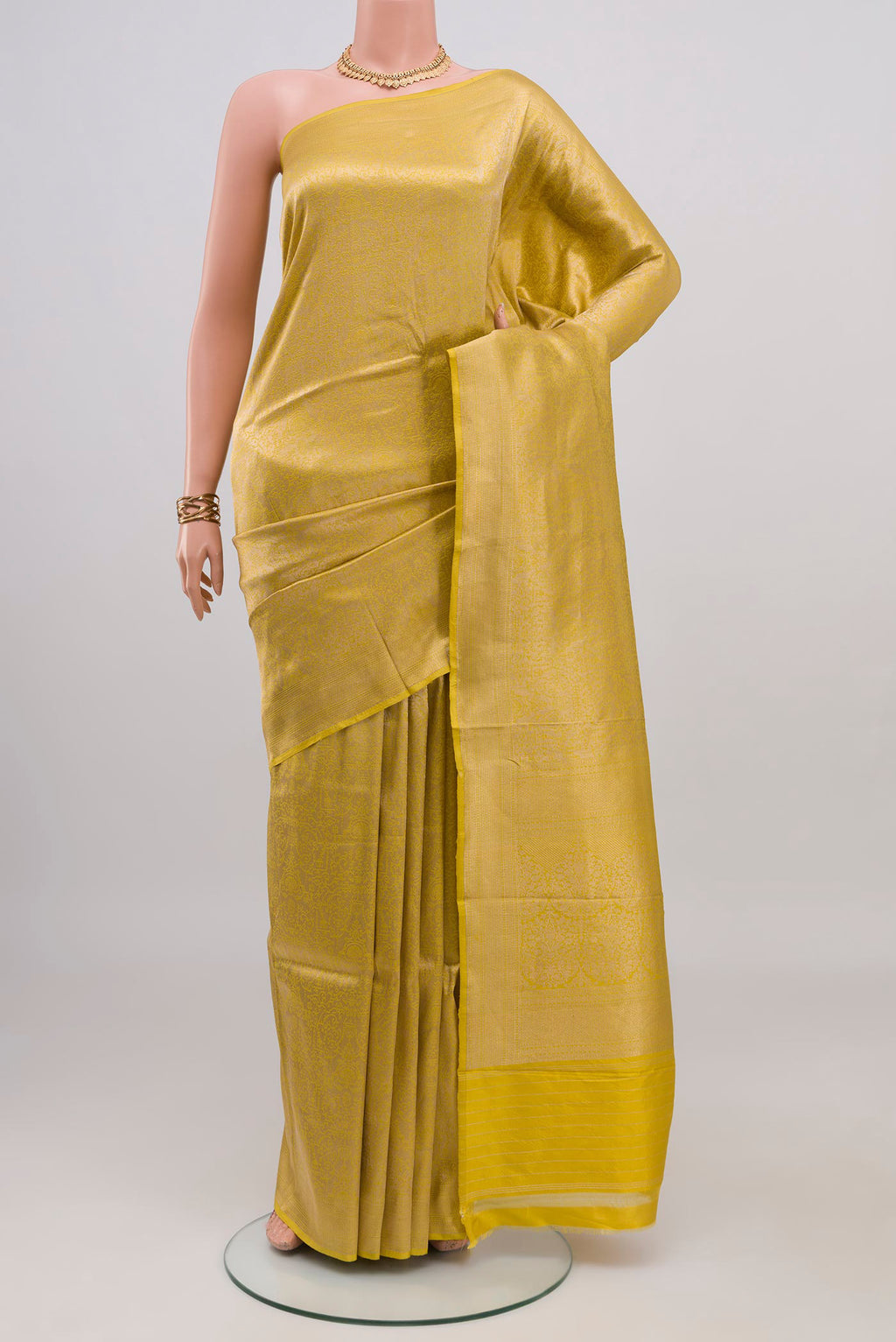 Yellow Banarasi Katan Silk Saree with Zari Brocade on the body and Fancy Border.  displayed on a mannequin