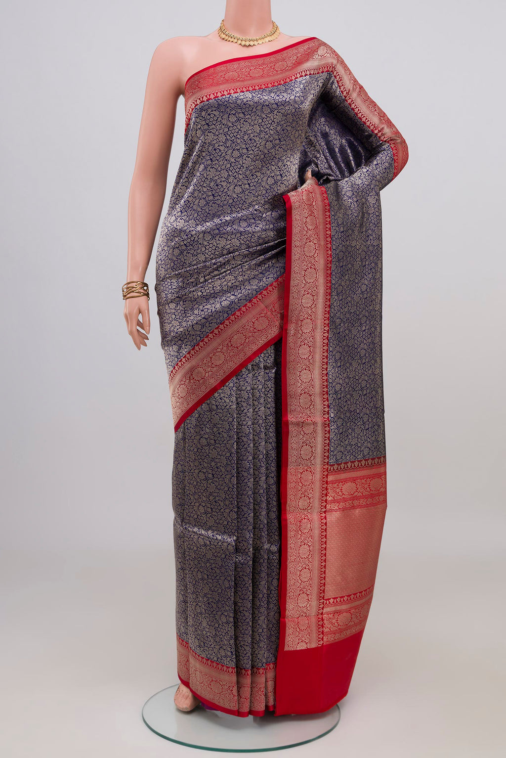 Navy Blue Banarasi Katan Silk Saree with Zari Brocade on the body and Zari Border.  displayed on a mannequin