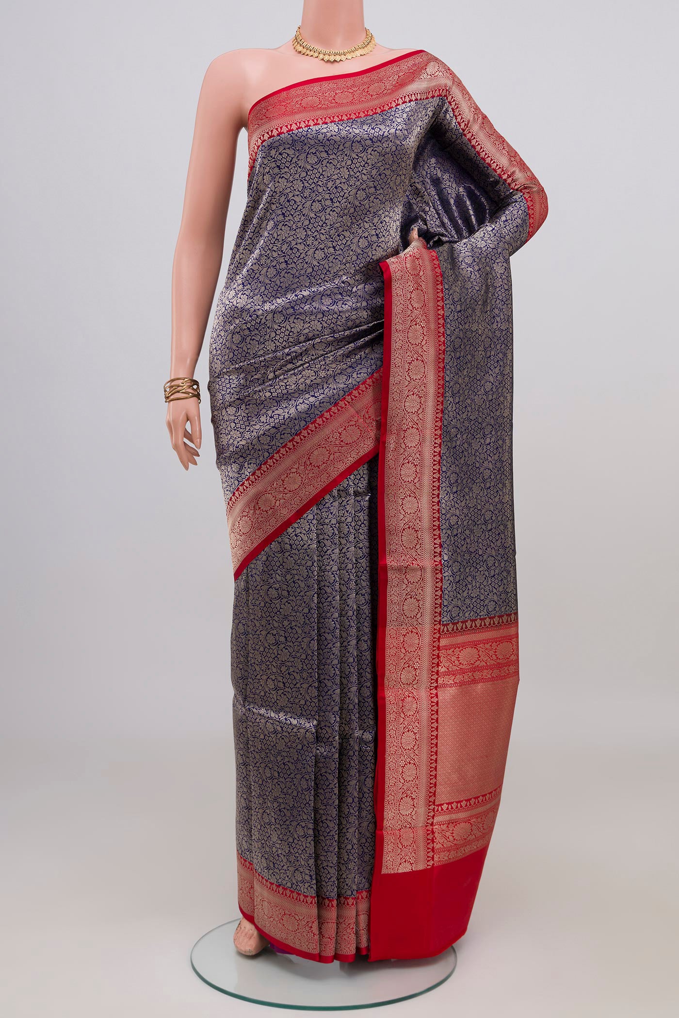 Navy Blue Banarasi Katan Silk Saree with Zari Brocade on the body and Zari Border.  displayed on a mannequin