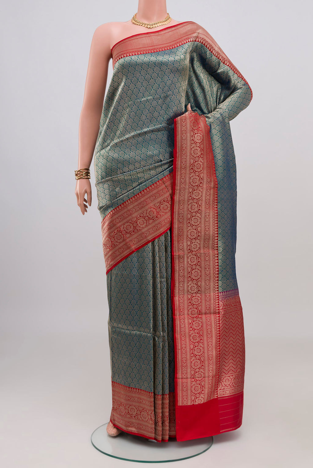 Peacock Blue Banarasi Silk Saree with Zari Brocade on the body and Zari Border.  displayed on a mannequin