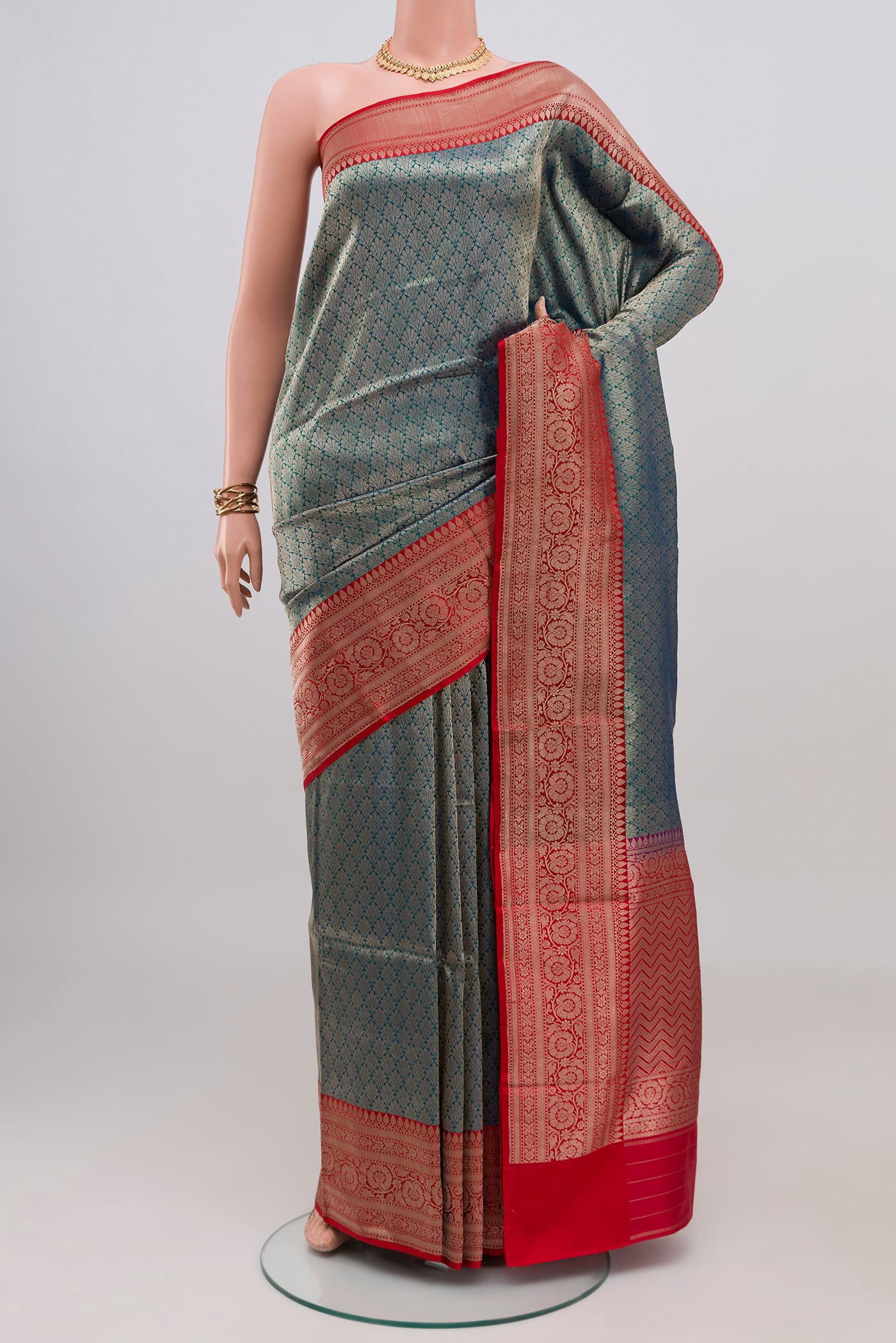 Peacock Blue Banarasi Silk Saree with Zari Brocade on the body and Zari Border.  displayed on a mannequin