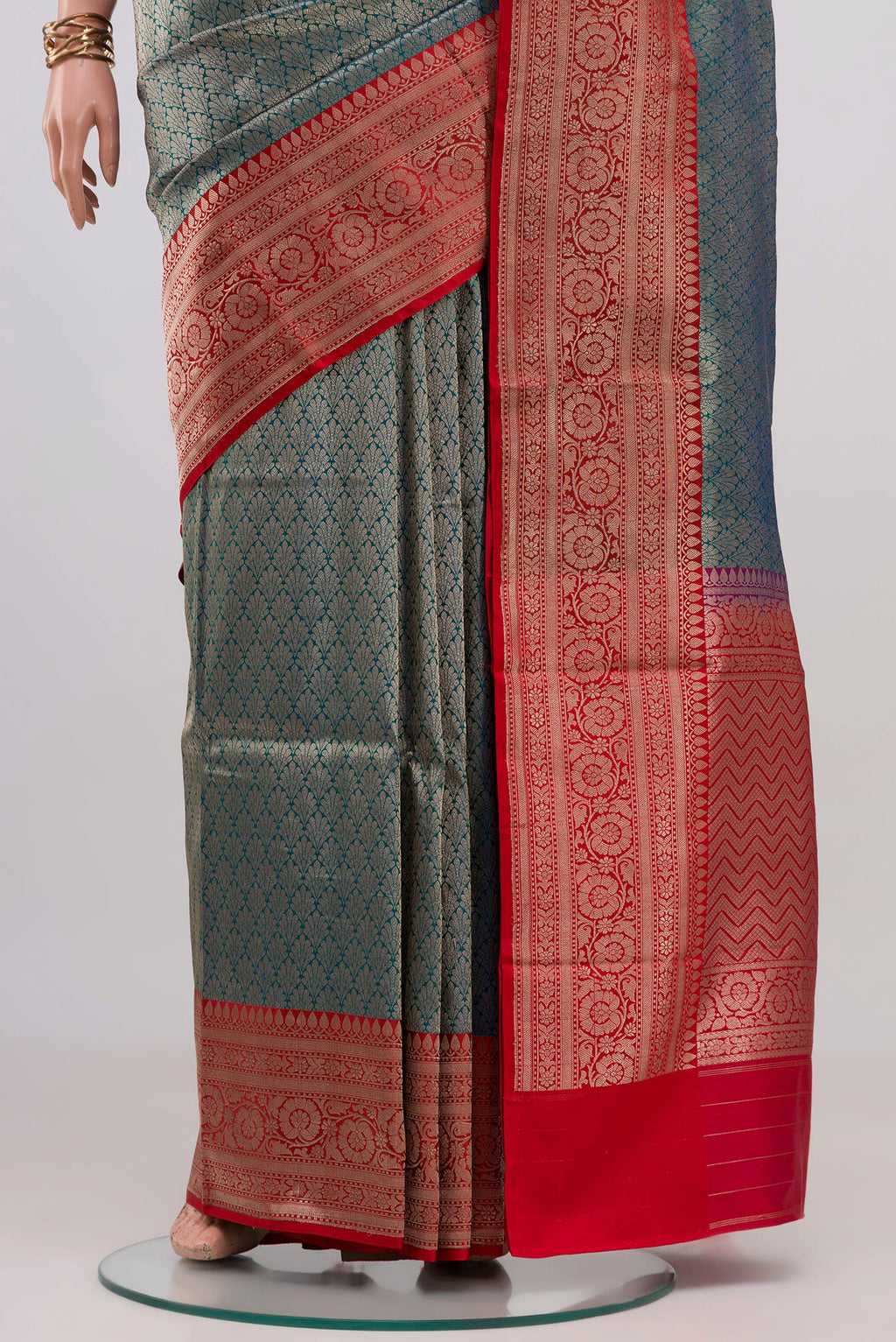 Pleats and pallu of Peacock Blue Banarasi Silk Saree with Zari Brocade on the body and Zari Border. 
