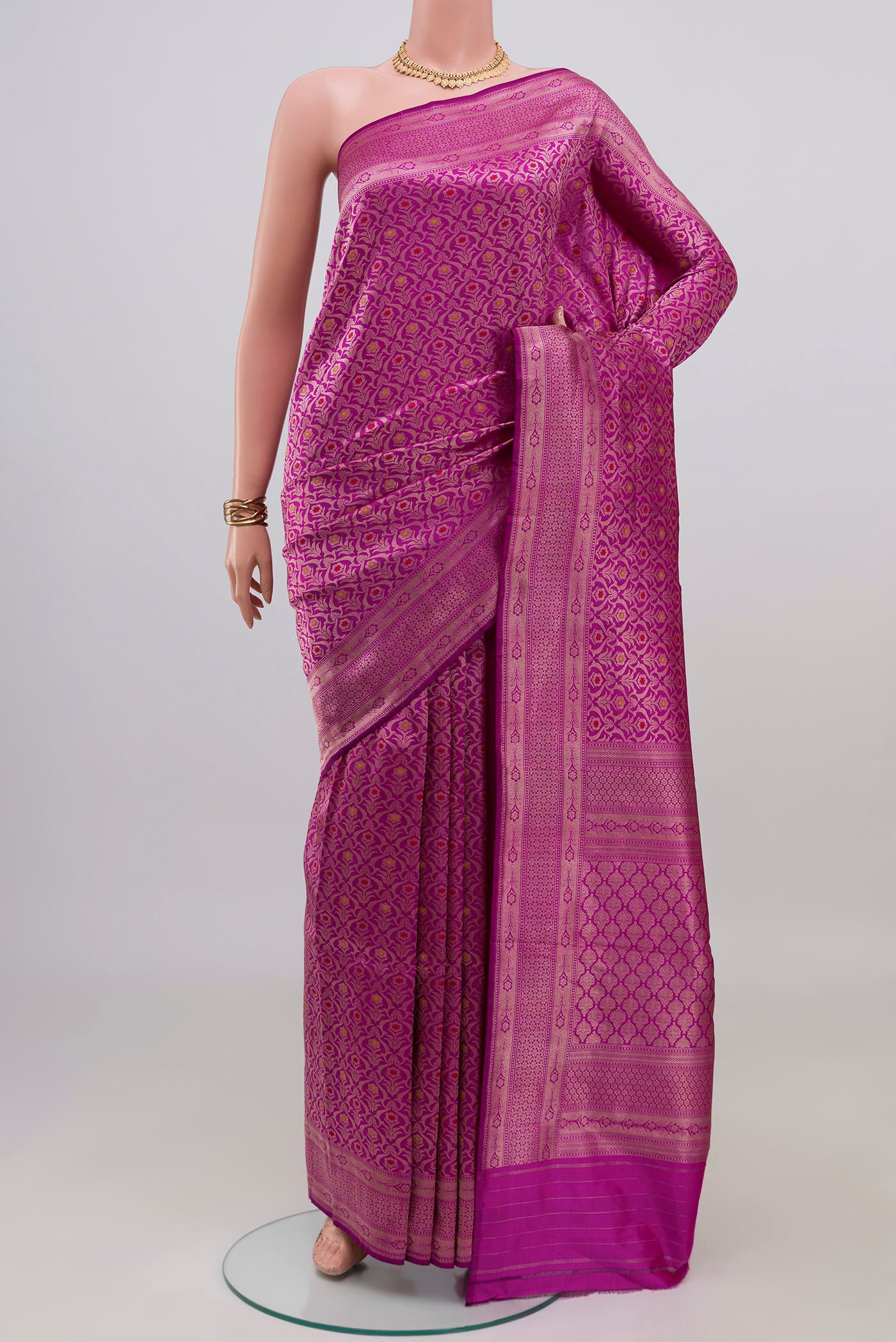 Purple Banarasi Katan Silk Saree with Zari Brocade on the body and Zari Border.  displayed on a mannequin