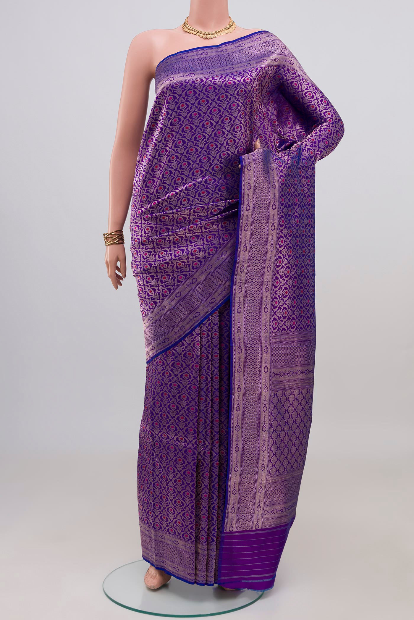 Purple Banarasi Katan Silk Saree with Zari Brocade on the body and Zari Border.  displayed on a mannequin