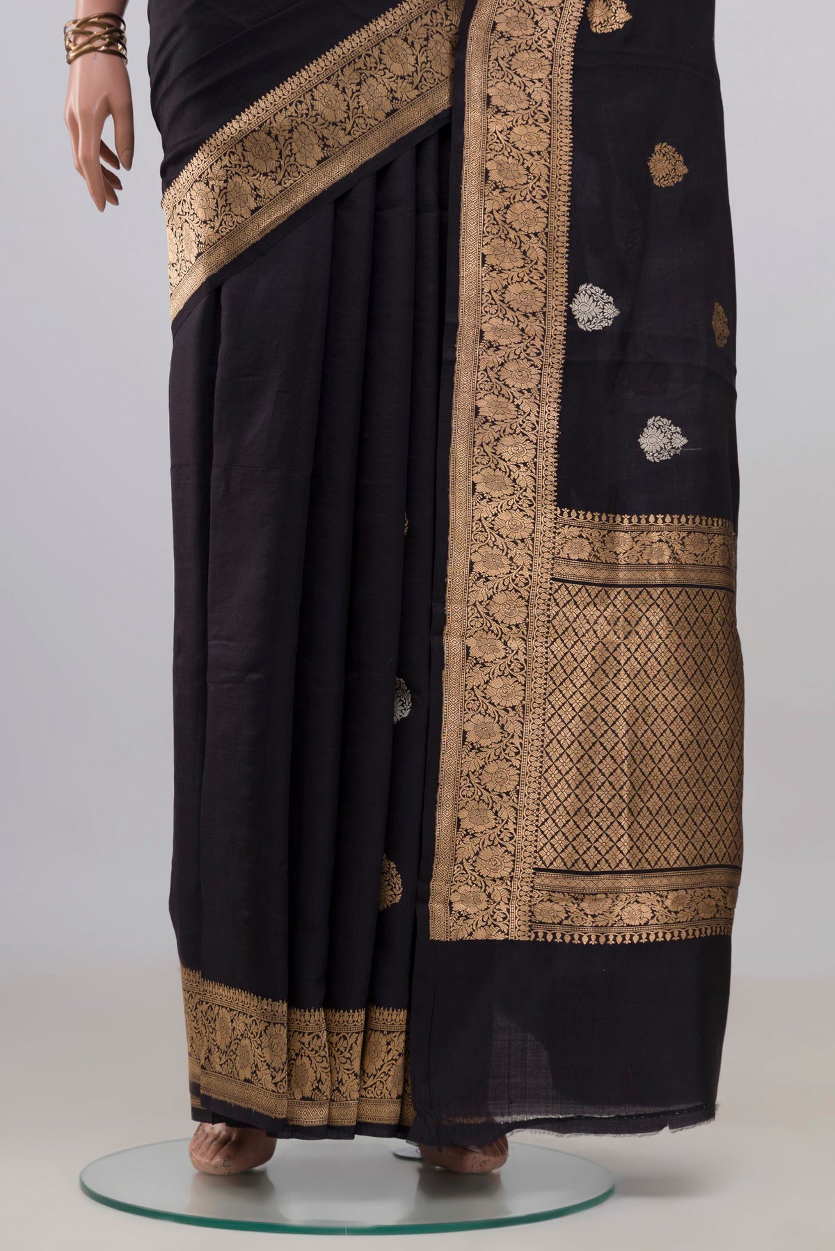 Pleats and pallu of Pure Silk Black Banarasi Katan Saree with Zari Butta on the body and Zari Border. 
