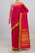 Pure Silk Pink Kanjivaram Saree with Thread Butta on the body and Thread Border.  displayed on a mannequin