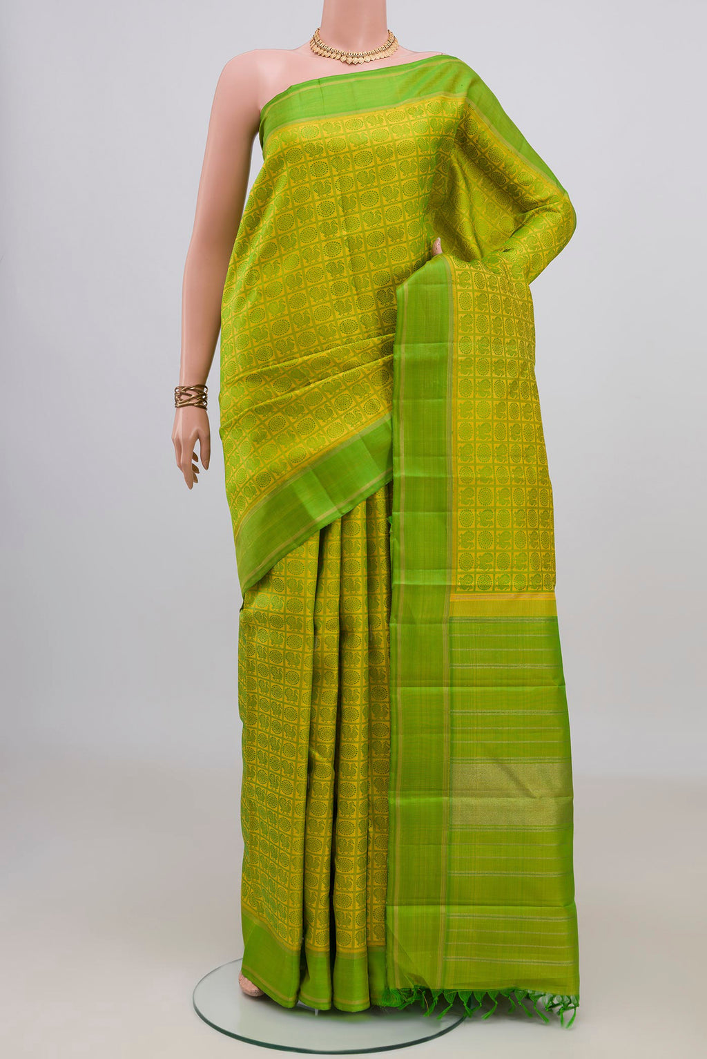 Pure Silk Pure Zari Yellow Kanjivaram Saree with Jacquard design on the body and Thread Border.  displayed on a mannequin