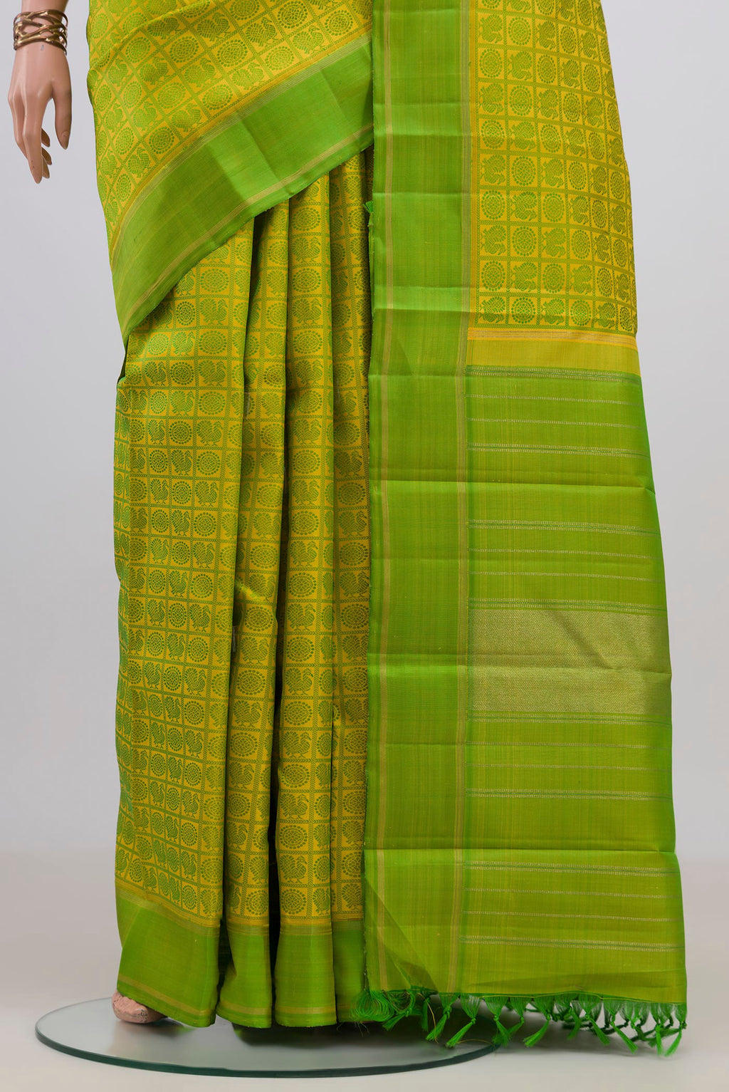 Pleats and pallu of Pure Silk Pure Zari Yellow Kanjivaram Saree with Jacquard design on the body and Thread Border. 