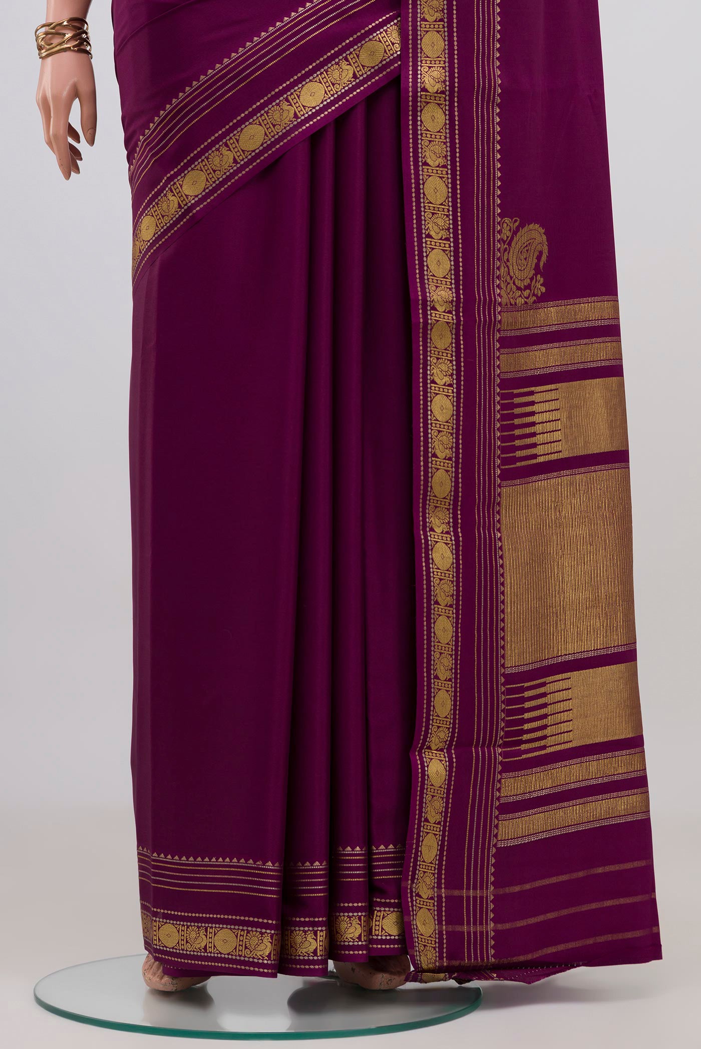 Pleats and pallu of Purple Mysore Crepe Saree with Plain Body and Zari Border. 