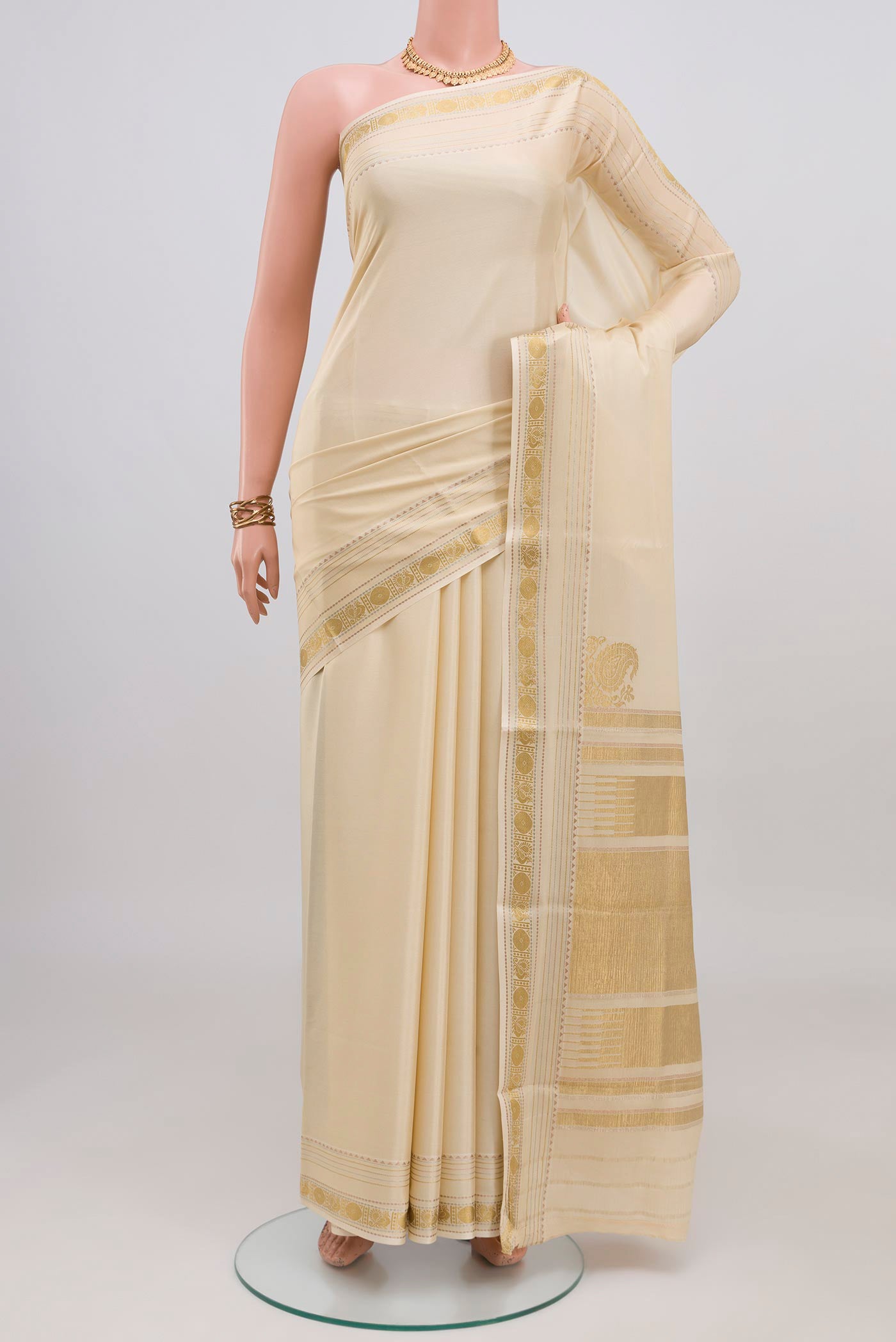 Cream Mysore Crepe Saree with Plain Body and Zari Border.  displayed on a mannequin