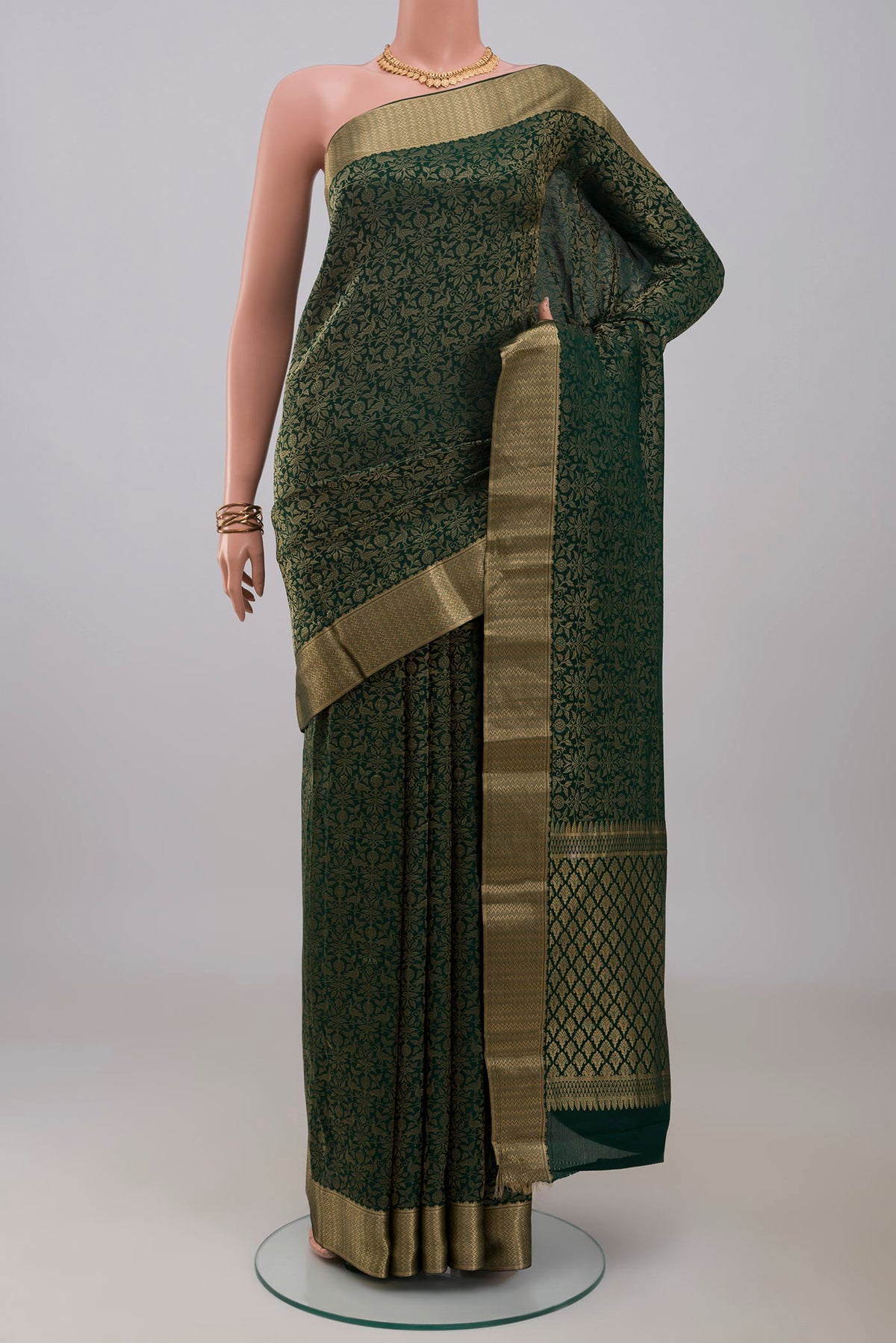 Bottle Green Mysore Crepe Saree with Zari Brocade on the body and Zari Border.  displayed on a mannequin