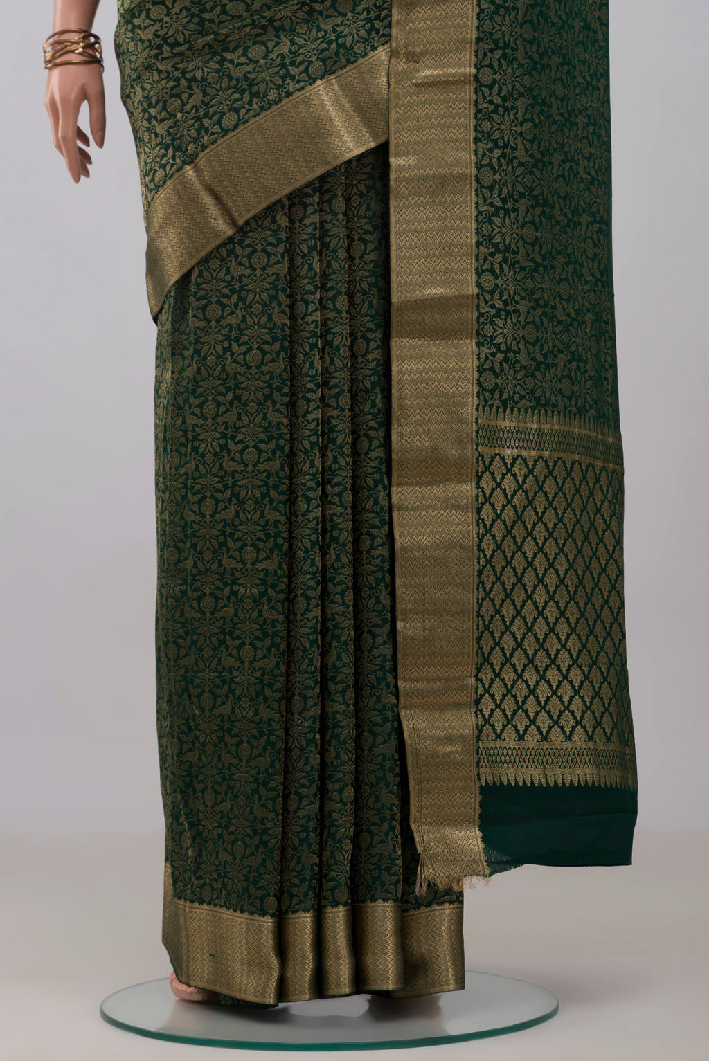 Pleats and pallu of Bottle Green Mysore Crepe Saree with Zari Brocade on the body and Zari Border. 