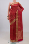 Red Mysore Crepe Saree with Zari Brocade on the body and Zari Border.  displayed on a mannequin