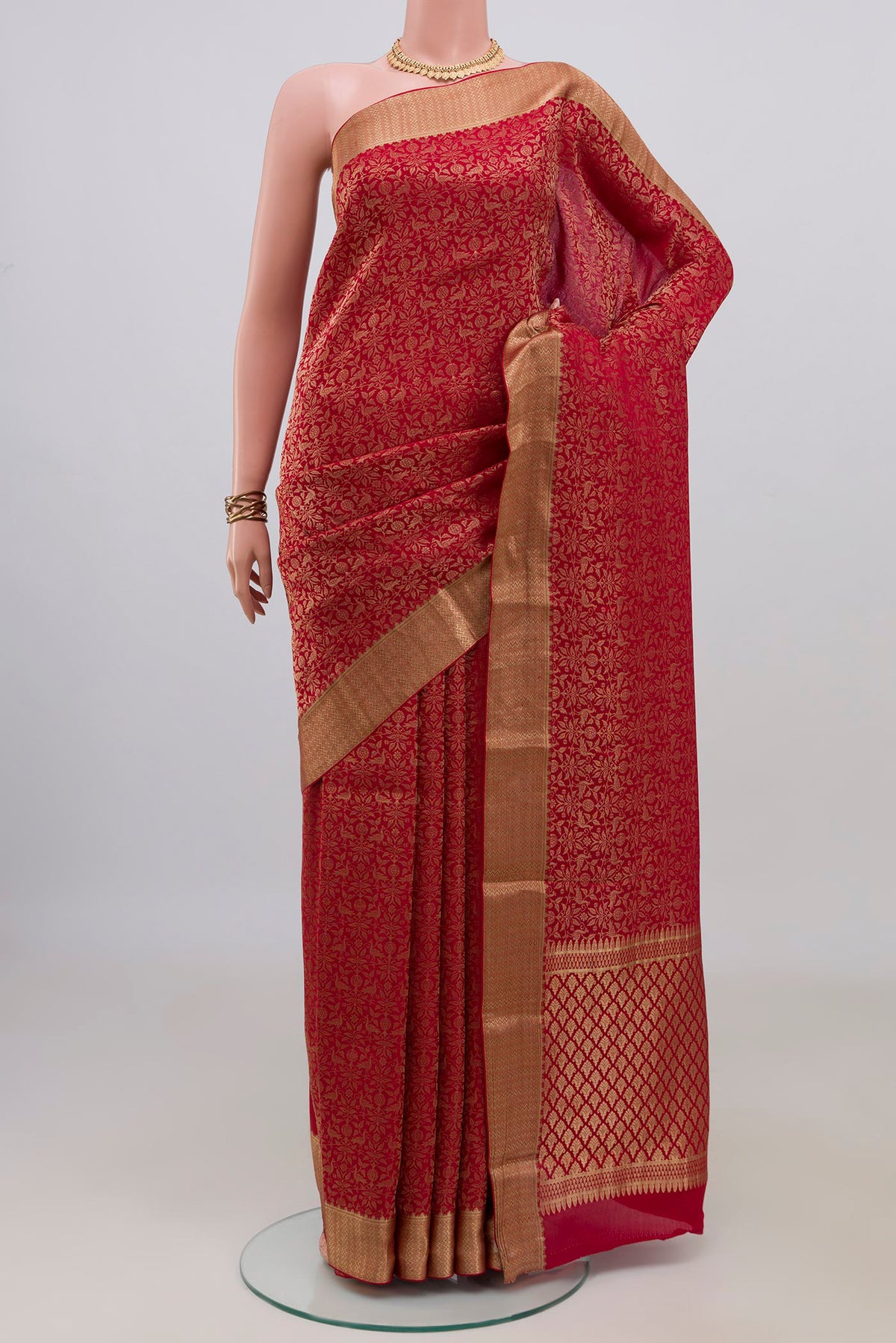 Red Mysore Crepe Saree with Zari Brocade on the body and Zari Border.  displayed on a mannequin