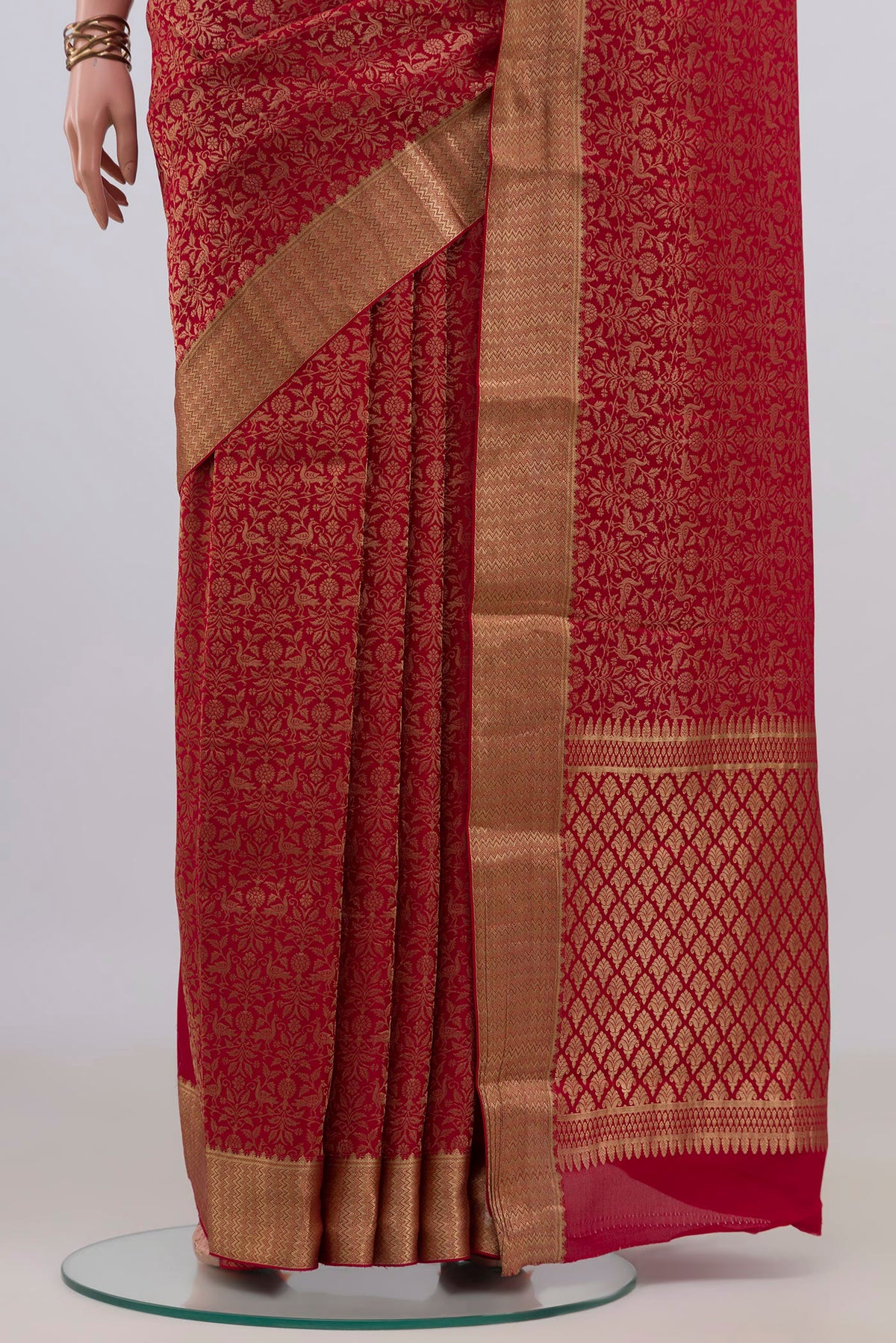 Pleats and pallu of Red Mysore Crepe Saree with Zari Brocade on the body and Zari Border. 