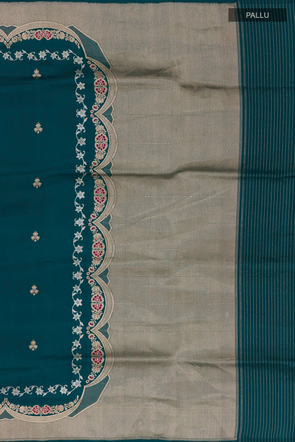 Close up image of the pallu of Pure Silk Teal Banarasi Saree with Zari Butta on the body and Fancy Border. 