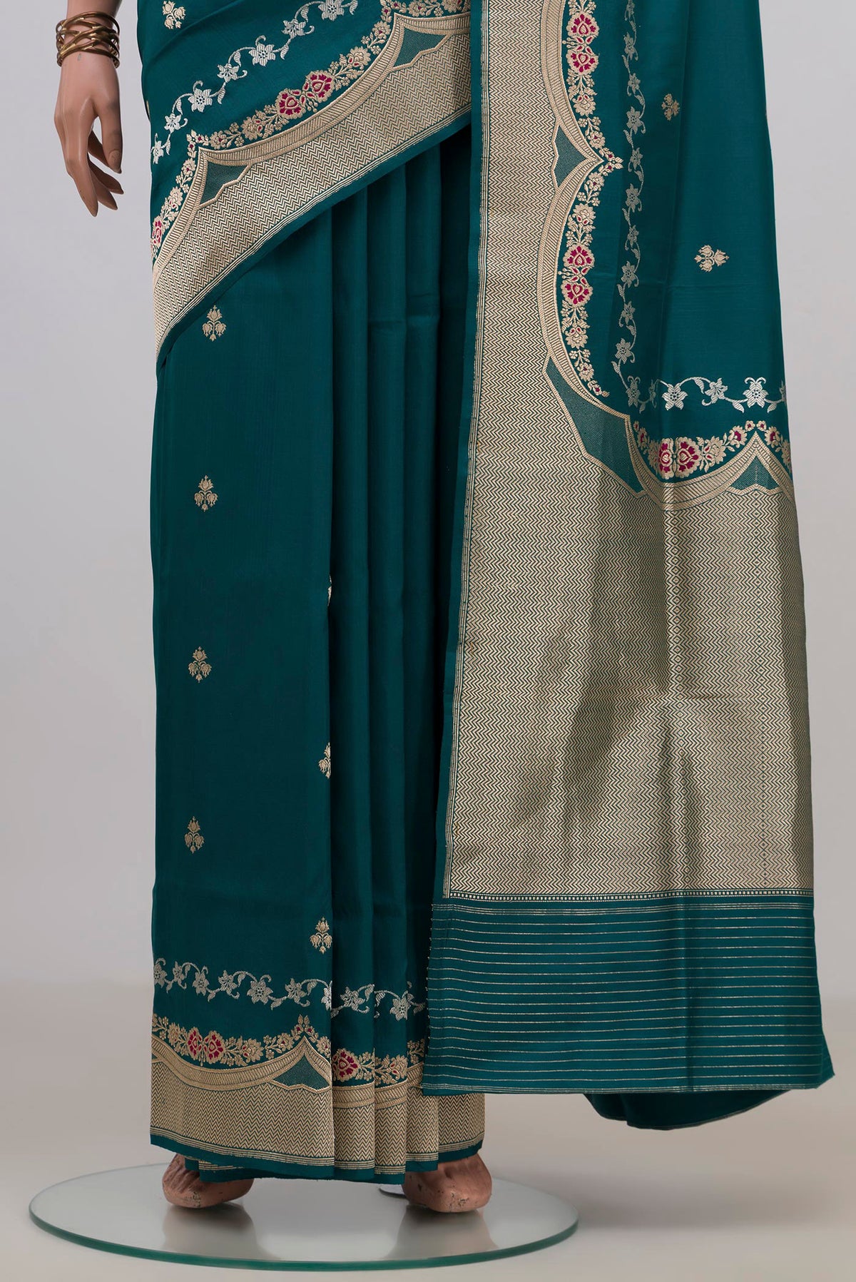 Pleats and pallu of Pure Silk Teal Banarasi Saree with Zari Butta on the body and Fancy Border. 