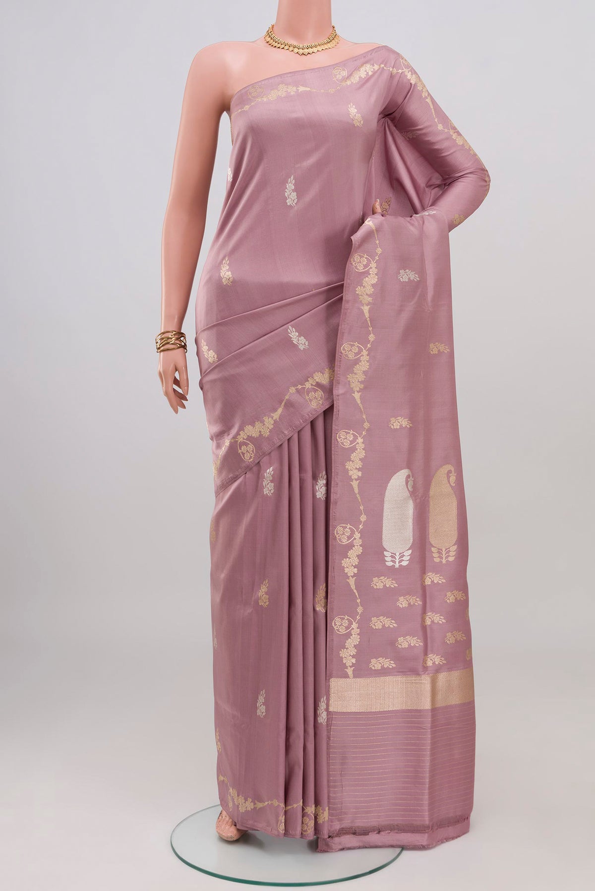 Pink Banarasi Saree with Zari Butta on the body and Fancy Border.  displayed on a mannequin