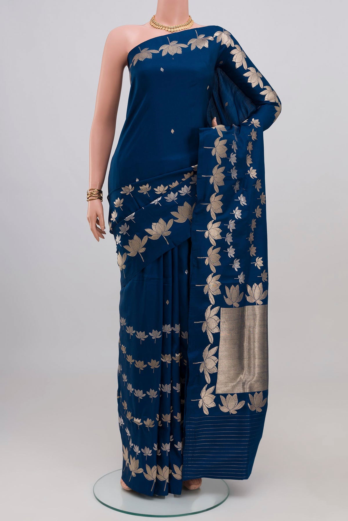 Blue Banarasi Saree with Zari Butta on the body and Fancy Border.  displayed on a mannequin
