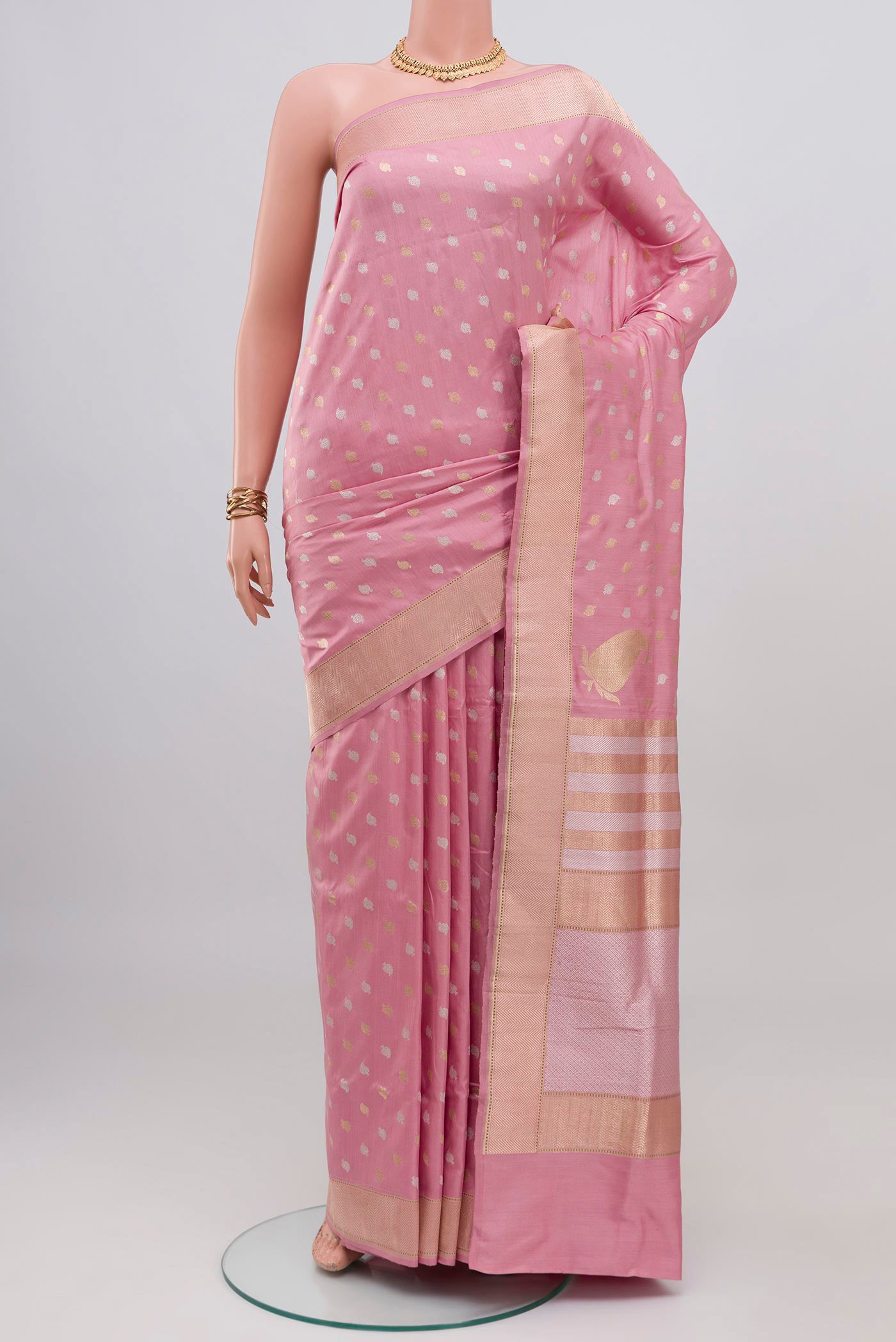 Rose pink Banarasi Silk Saree with Zari Butta on the body and Zari Border.  displayed on a mannequin