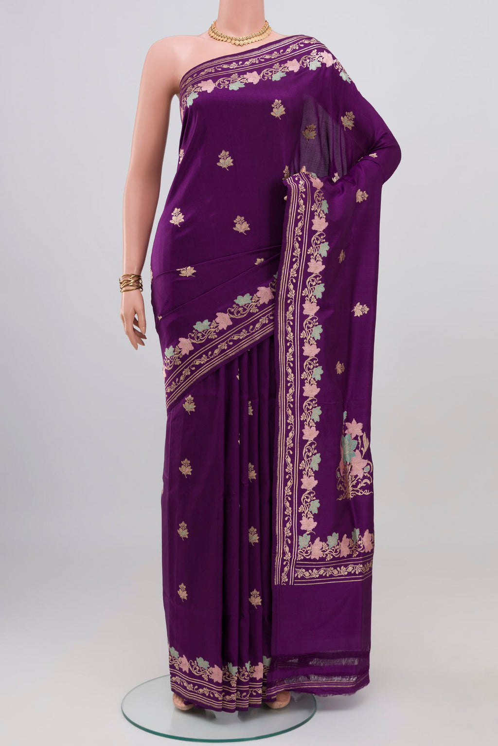Purple Banarasi Silk Saree with Zari Butta on the body and Fancy Border.  displayed on a mannequin