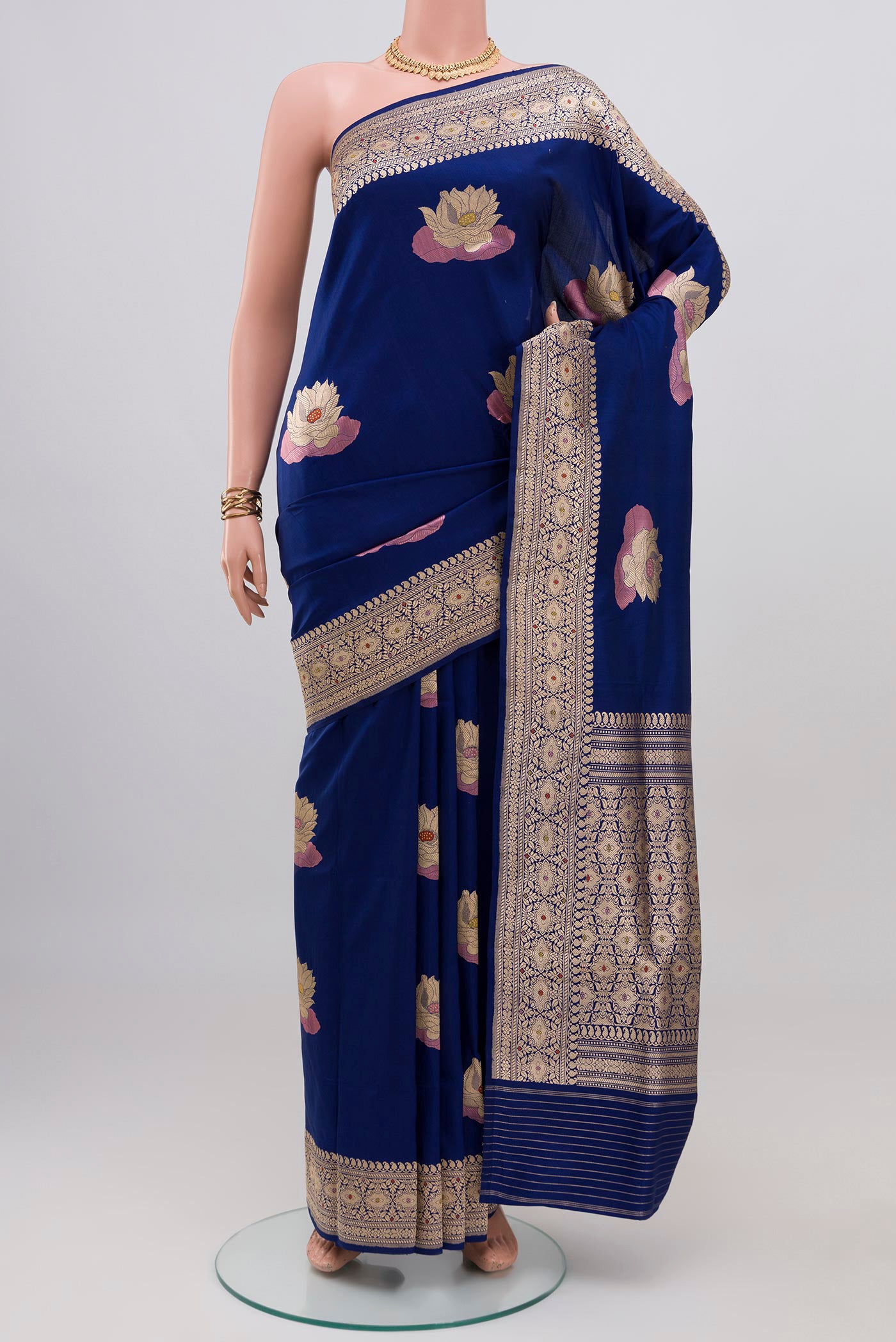 Blue Banarasi Silk Saree with Zari Butta on the body and Zari Border.  displayed on a mannequin