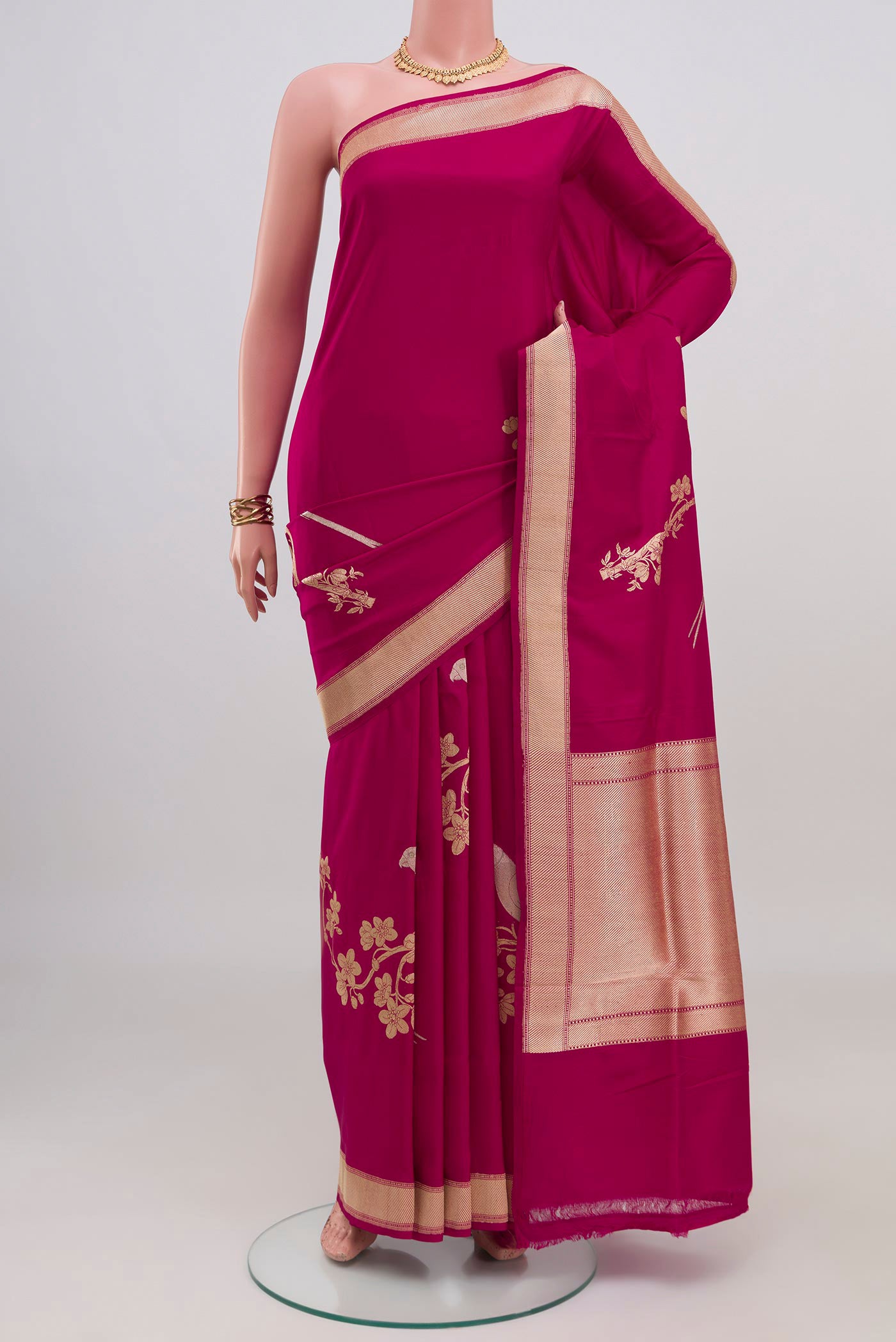 Dark Pink Banarasi Silk Saree with Zari Butta on the body and Zari Border.  displayed on a mannequin