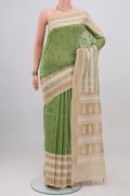 Pista Green Tussar Silk Saree with Embroidery on the body and Zari And Thread Border.  displayed on a mannequin