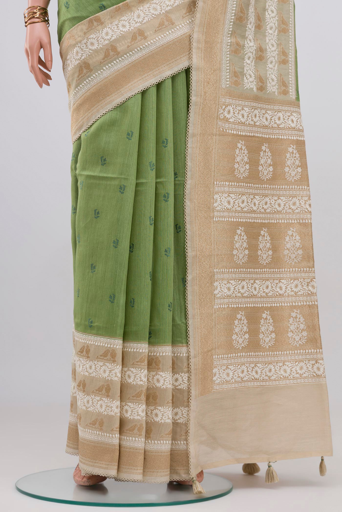 Pleats and pallu of Pista Green Tussar Silk Saree with Embroidery on the body and Zari And Thread Border. 