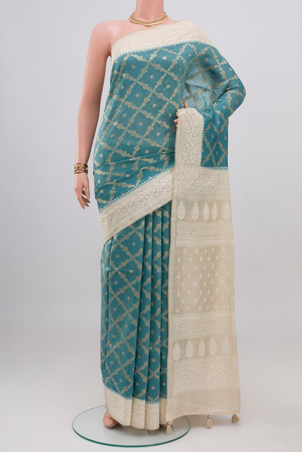 Blue Tussar Silk Saree with Fancy on the body and Fancy Border.  displayed on a mannequin