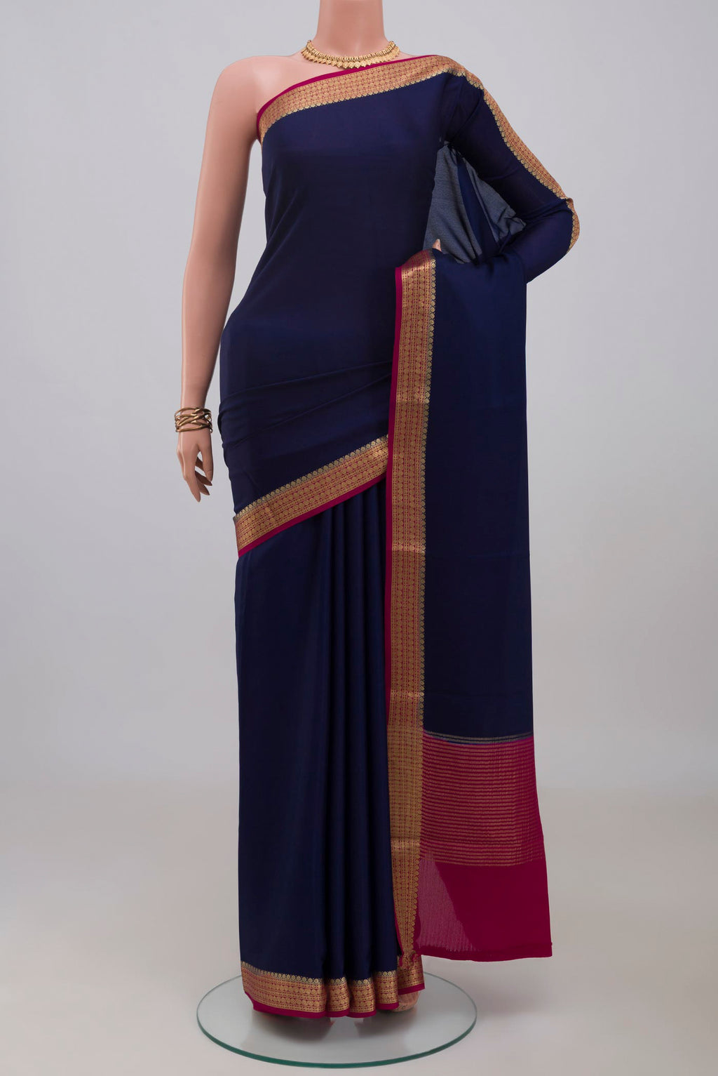 Navy Blue Mysore Crepe Saree with Plain Body and Zari Border.  displayed on a mannequin